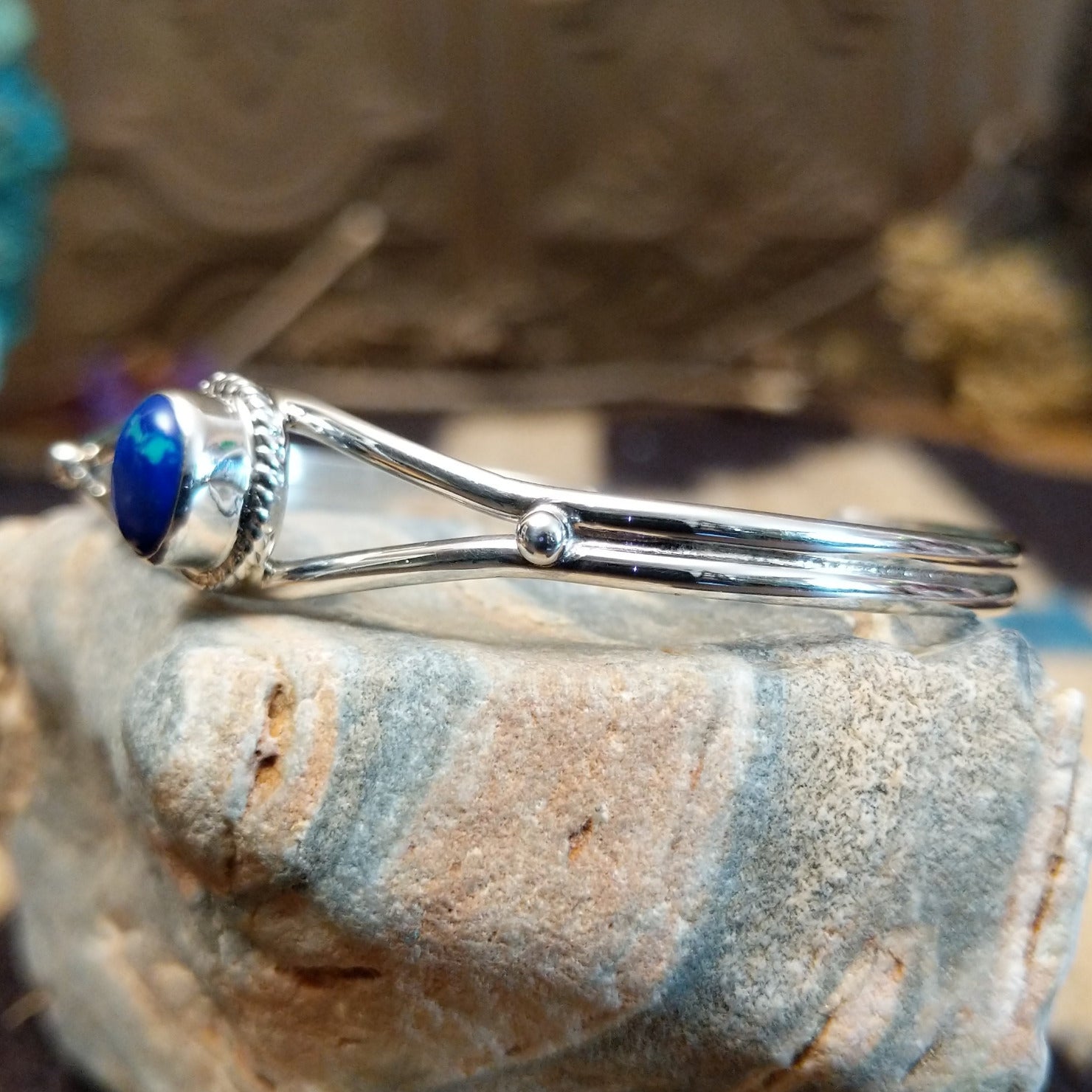 Sterling silver cuff with azurite malachite set in an oval bezel, framed by twisted rope accents.
