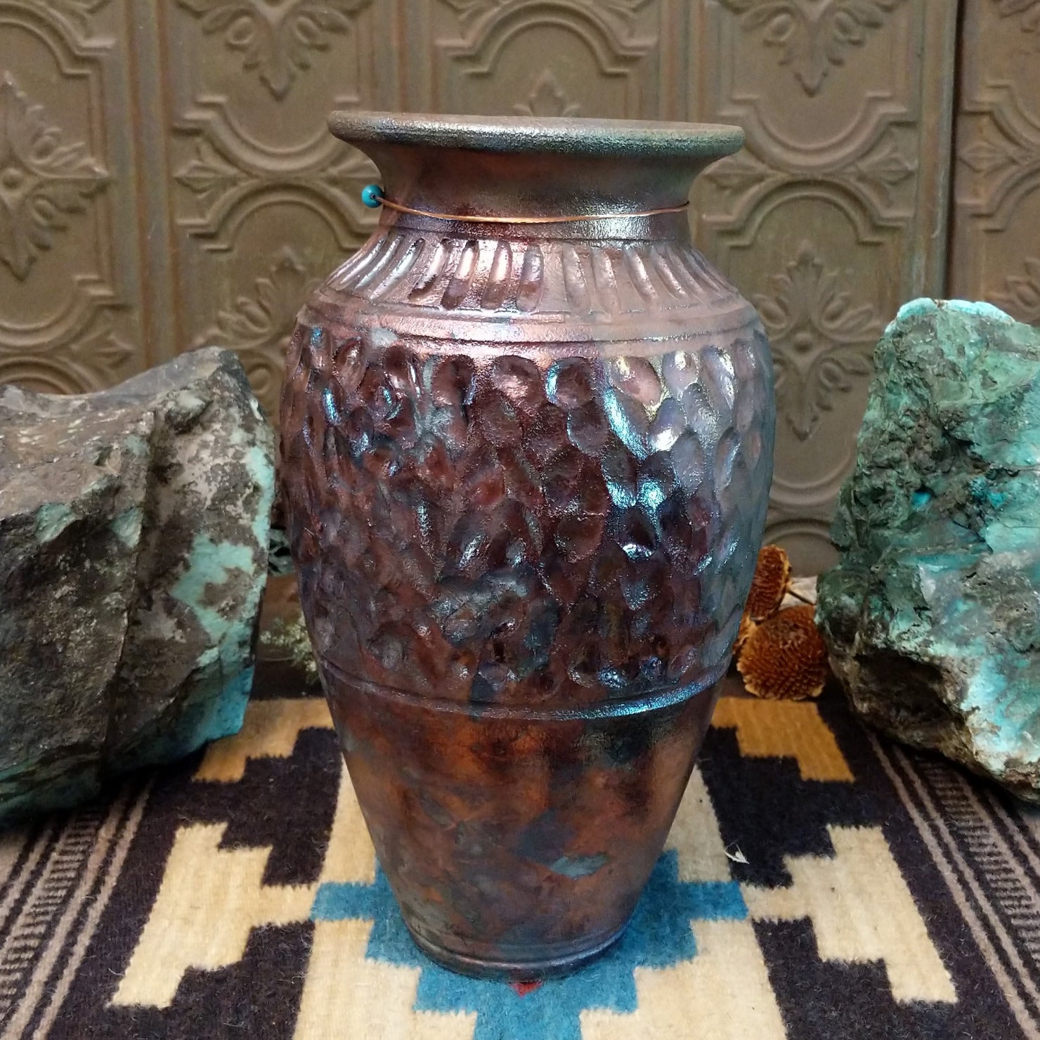 Ceramic and copper dimpled pottery vase.