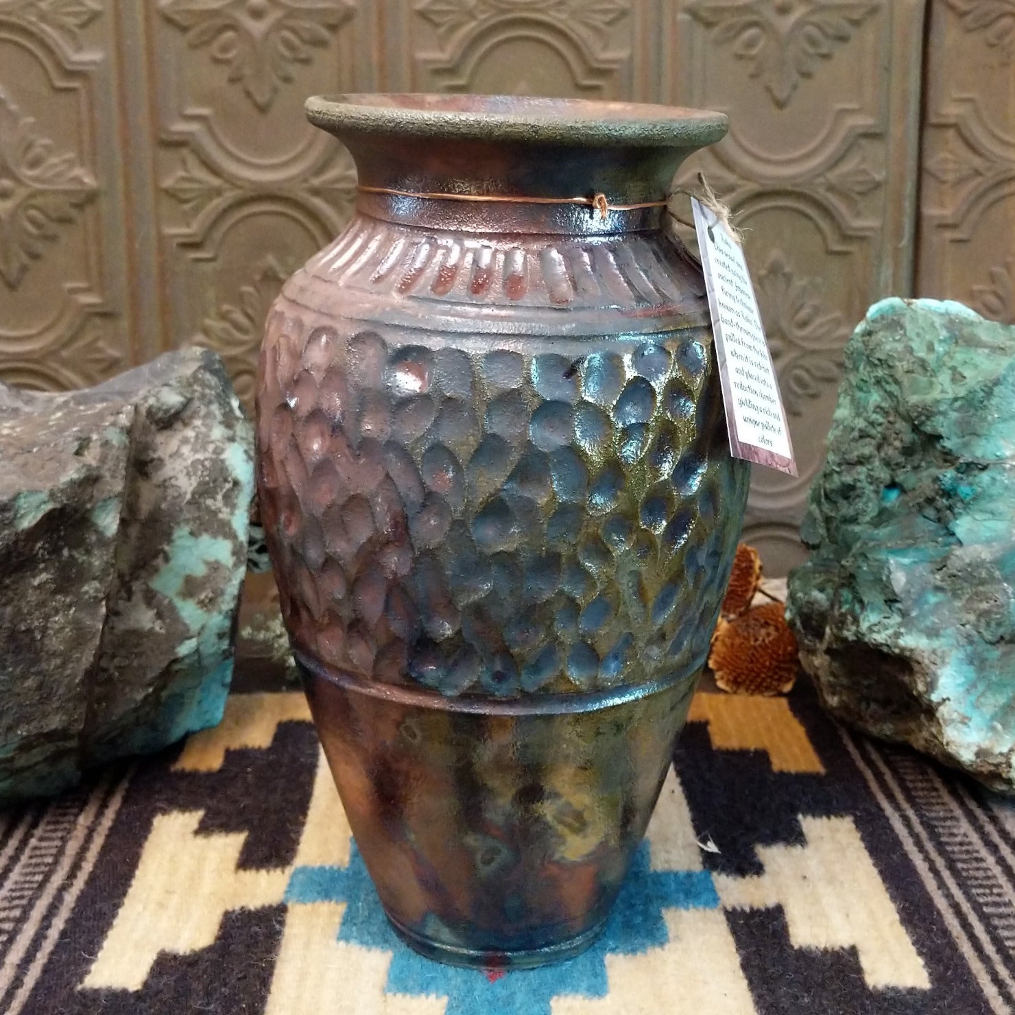 Ceramic and copper dimpled pottery vase.