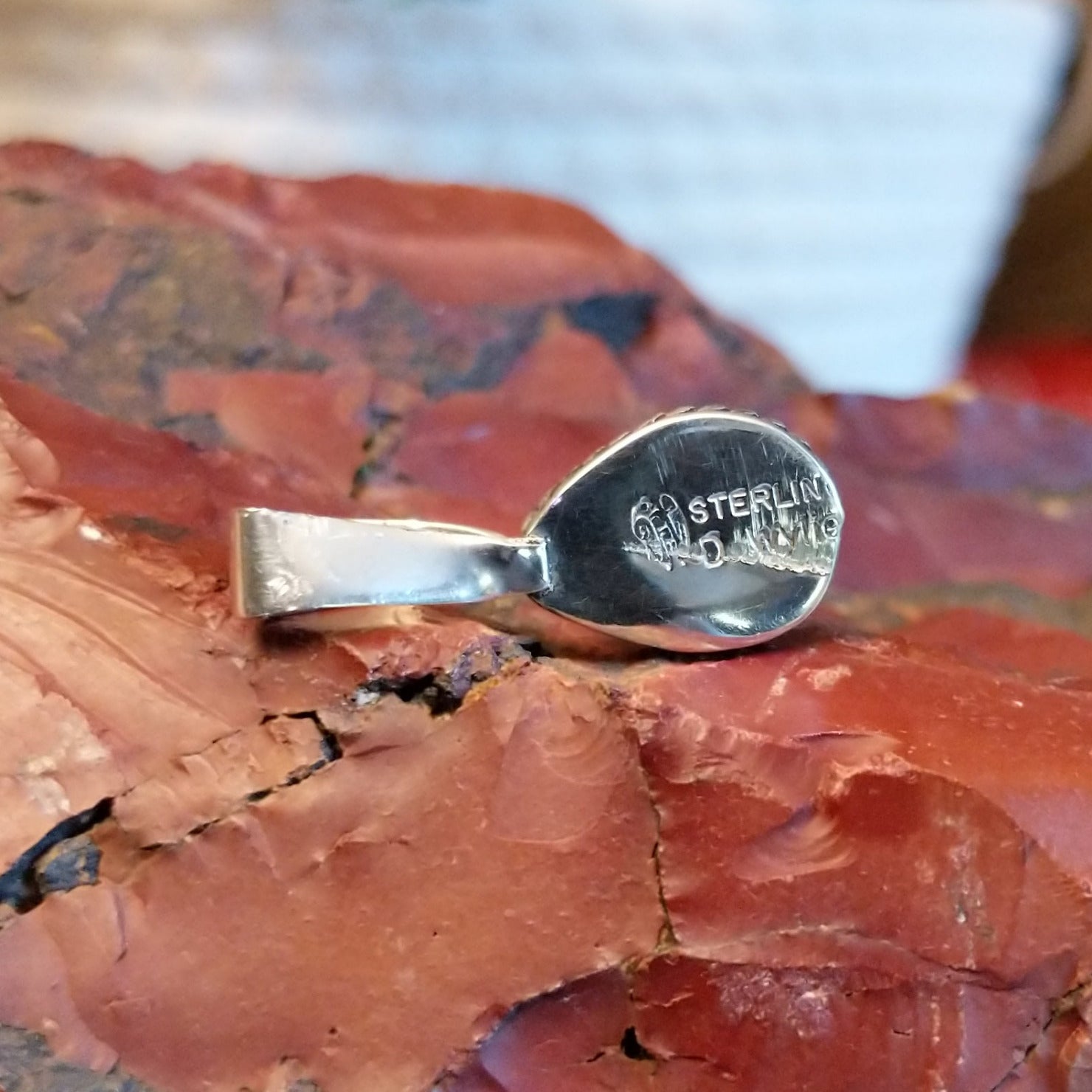 Close-up of the artisan's stamped signature.