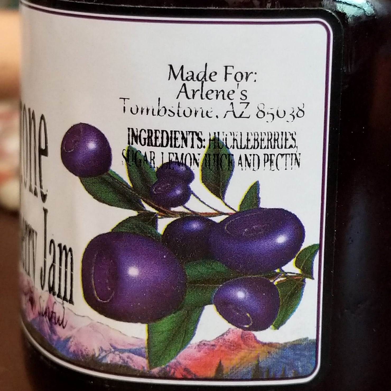 Bottle of huckleberry jam showing the ingredients