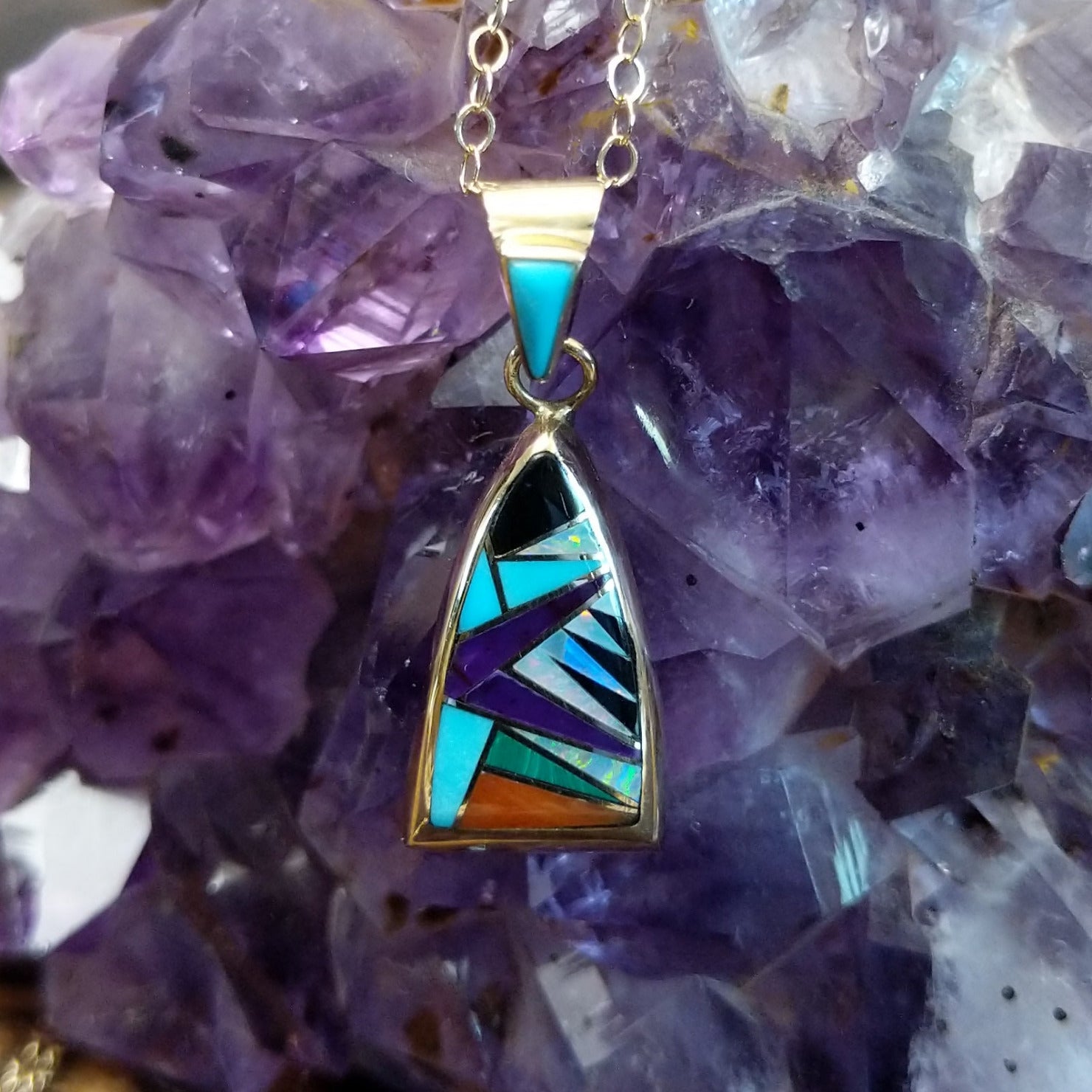 14kt gold Donald Douglas triangular pendant with geometric multistone inlay.