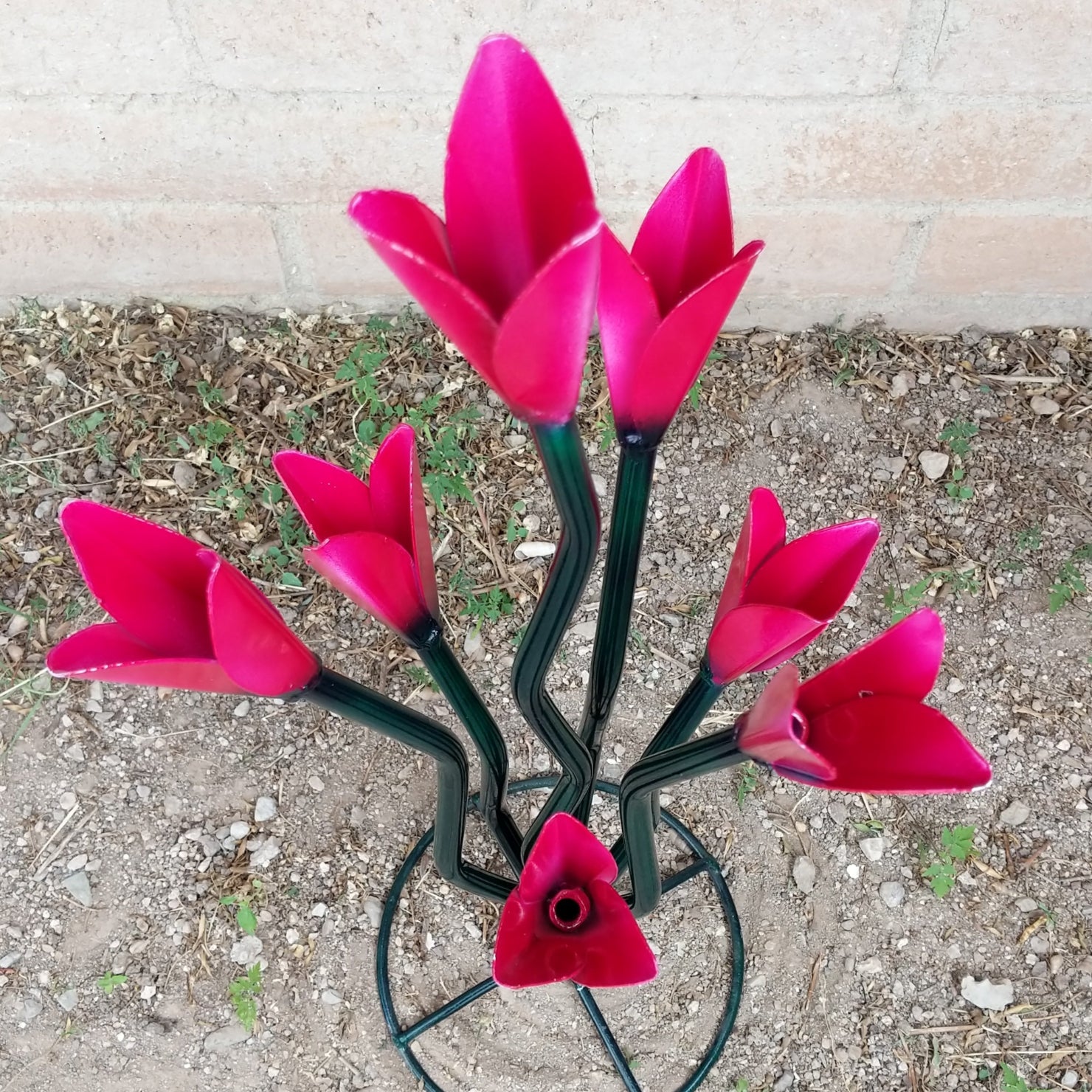 Close-up reveals the glossy pink finish and subtle light pink accents of the petals.
