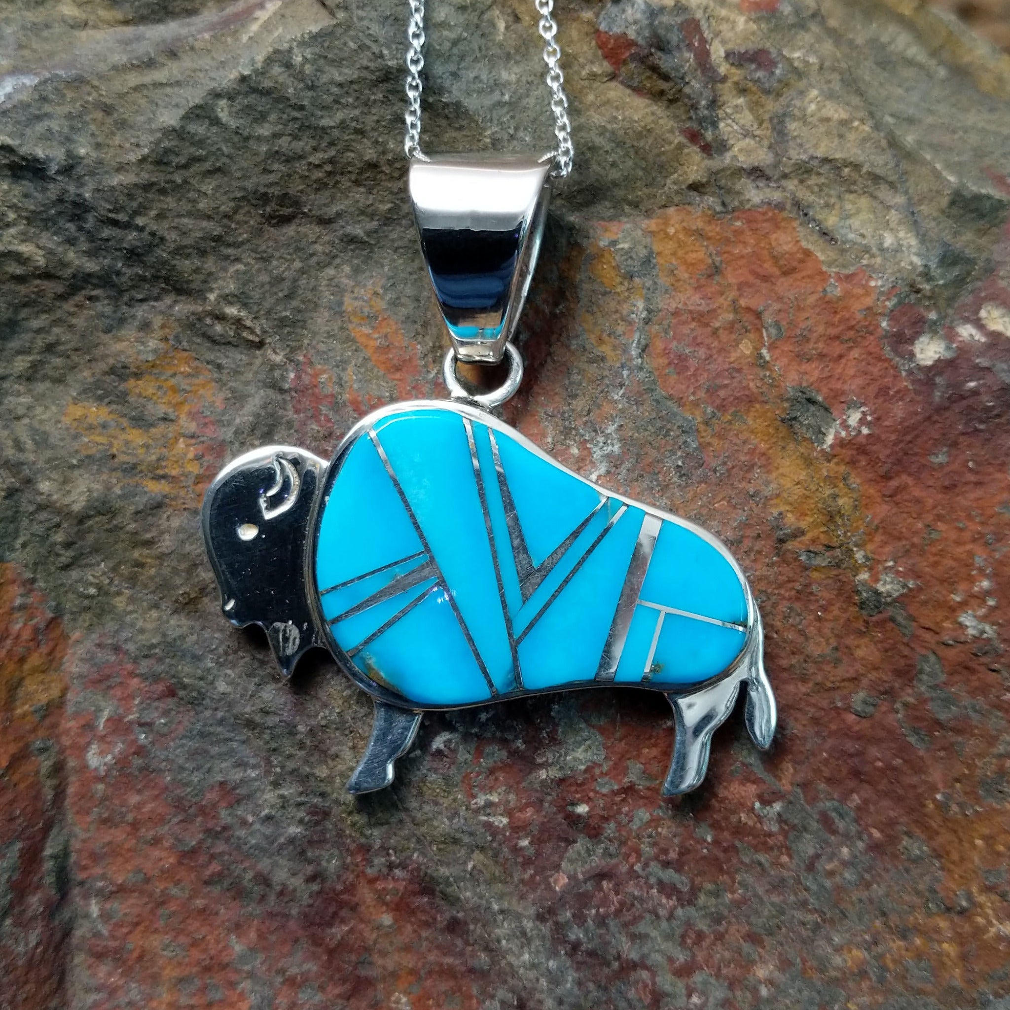 Handcrafted sterling silver turquoise buffalo inlay pendant by Evangie David, featuring a traditional buffalo design.