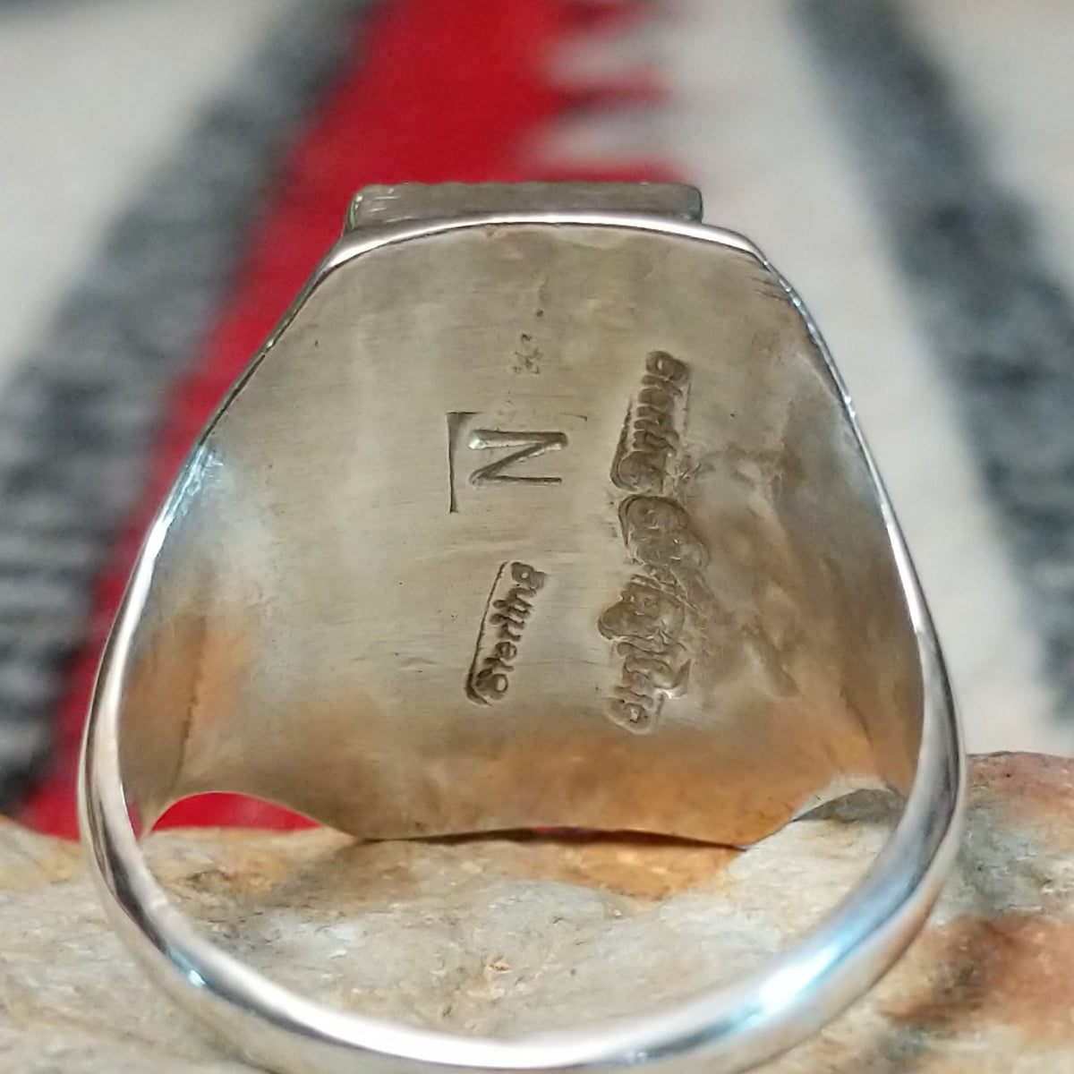 Close up of the artist's stamped signature