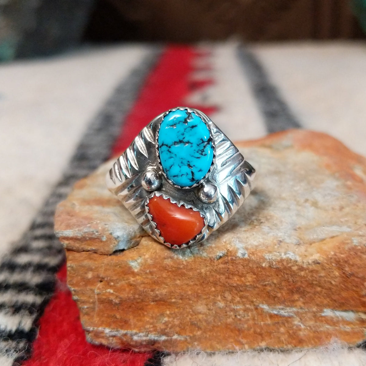 Turquoise and coral silver ring by Pauline Nelson with fan-shaped detailing.