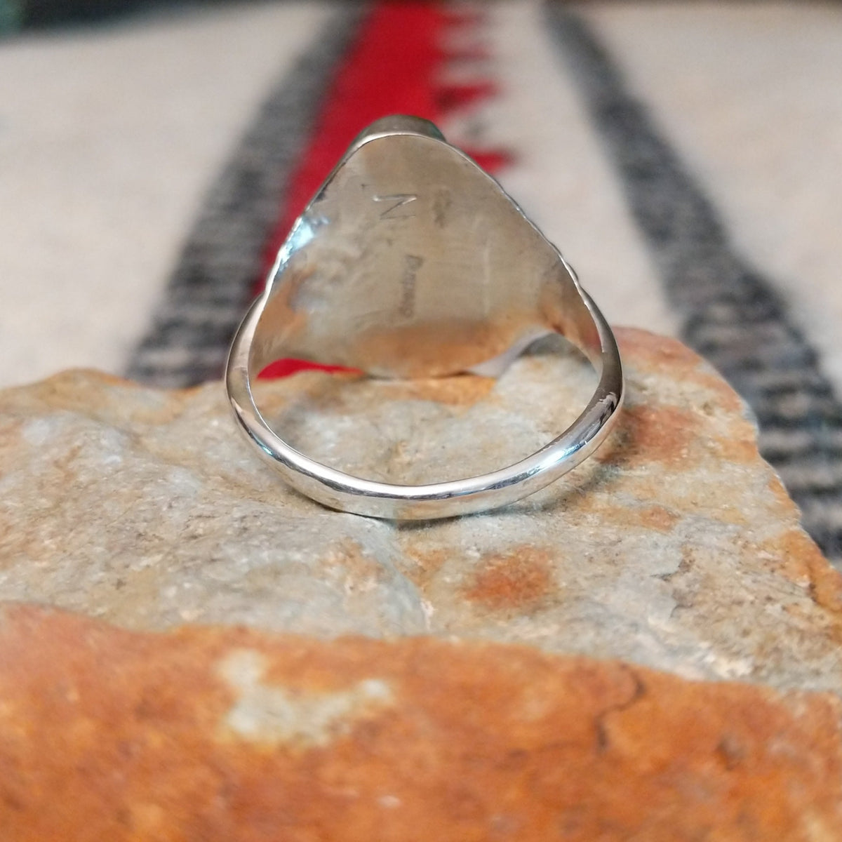 Turquoise and coral silver ring by Pauline Nelson with fan-shaped detailing.