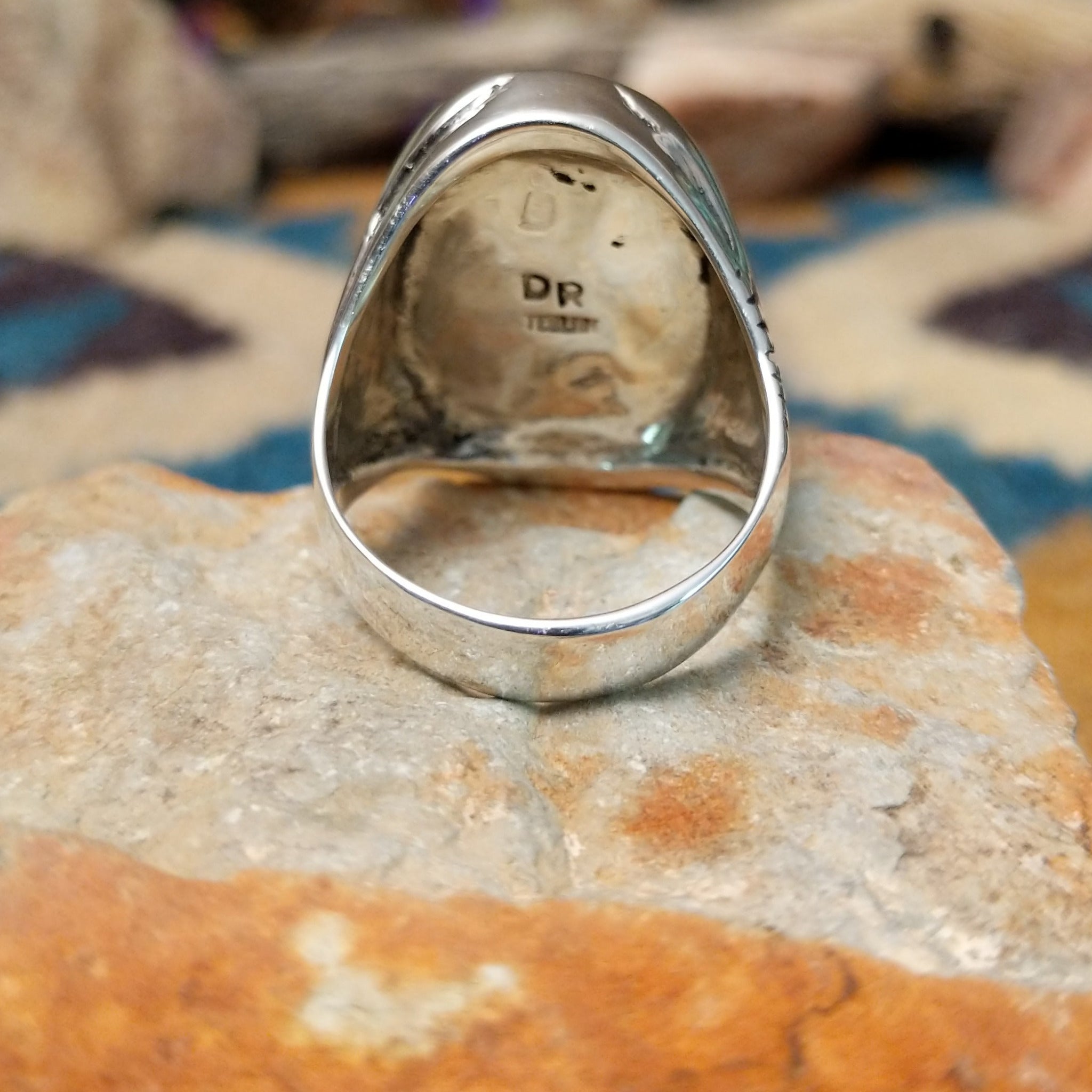 Sterling silver Turquoise inlay ring by Dennis Ramone with an oval geometric mosaic design; underside view.