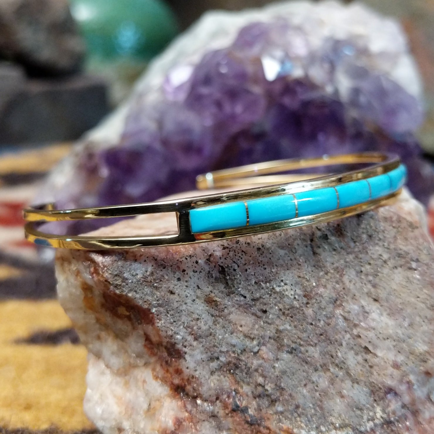 14k gold cuff by Steve Francisco with single row turquoise inlay.