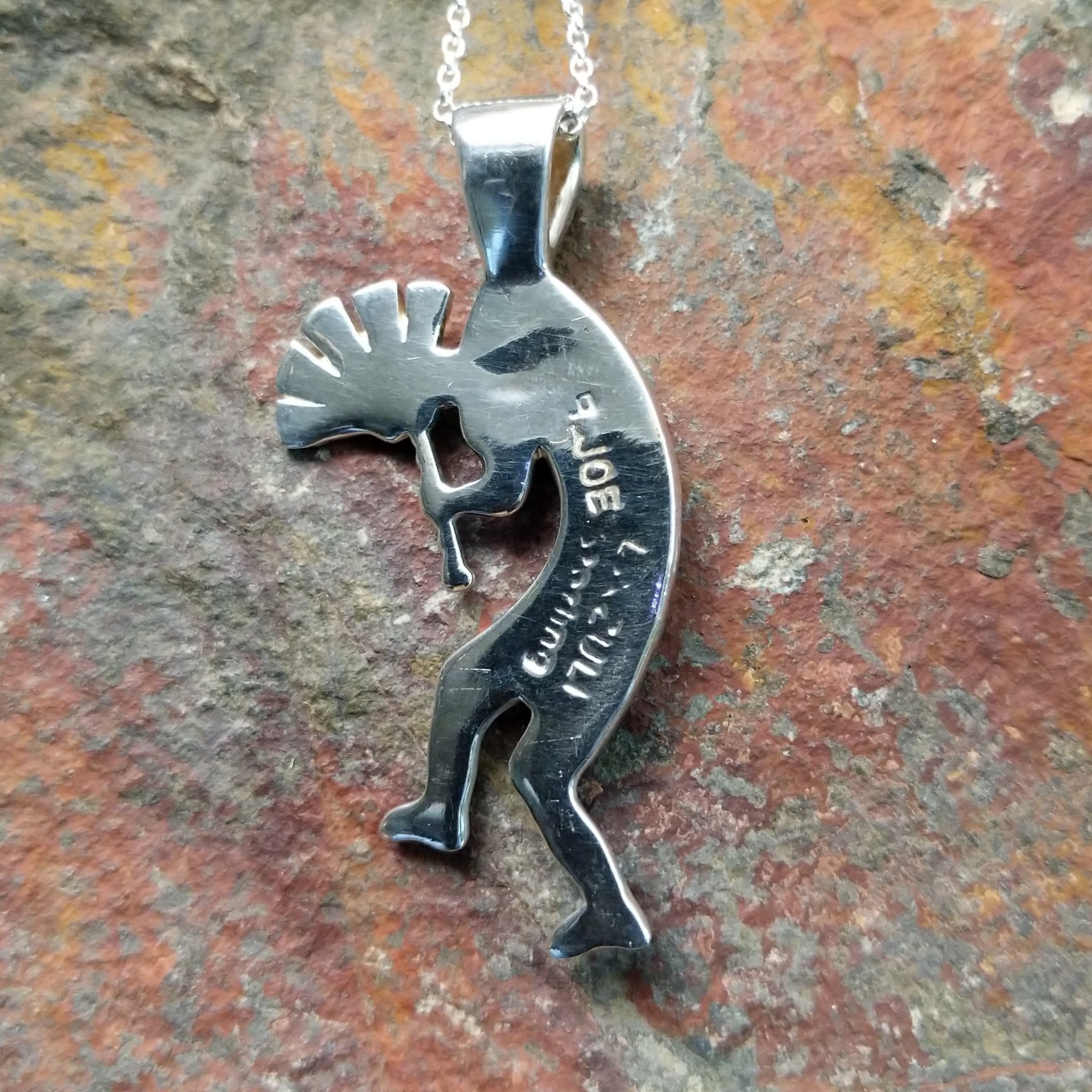 Handcrafted sterling silver turquoise Kokopelli pendant by Bernadine Joe, featuring a traditional Navajo Kokopelli design; artisan and Sterling Silver stamp.