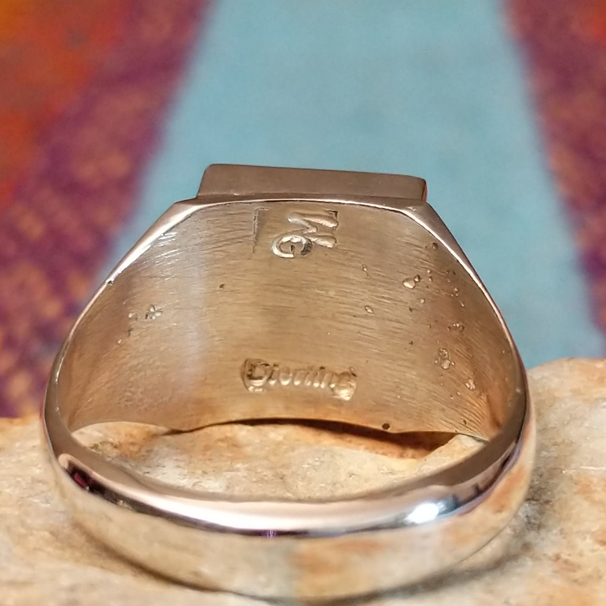 Close up of the artist's stamped signature
