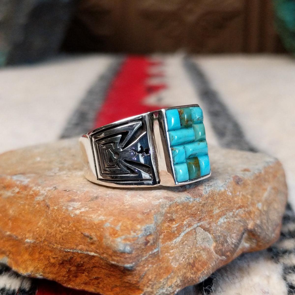 Turquoise inlay ring by Donald Douglas with Man in the Maze design.