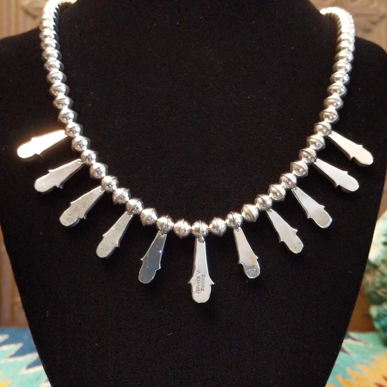 The back features the polished sterling silver bezels.