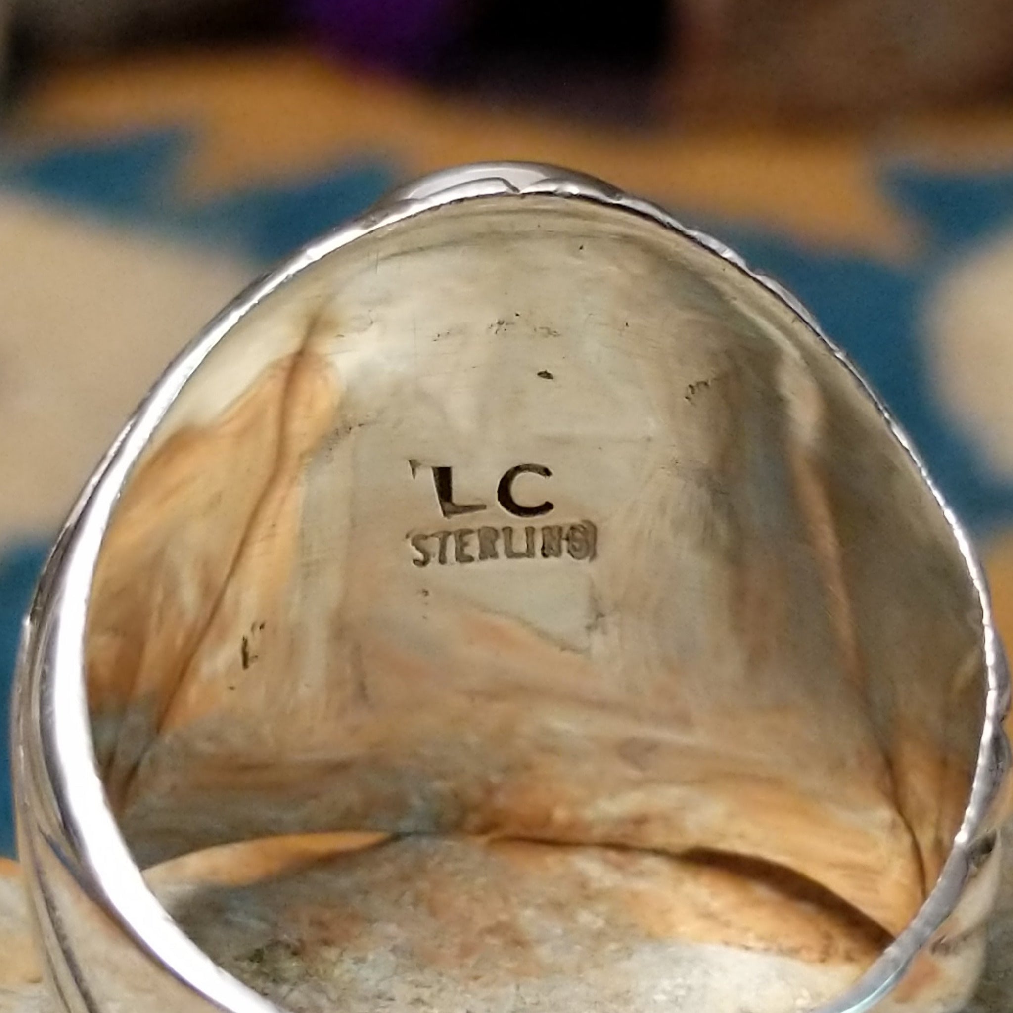 Sterling silver Turquoise inlay ring by L.C. with blue and green geometric strip inlay; artisan and Sterling Silver stamp.