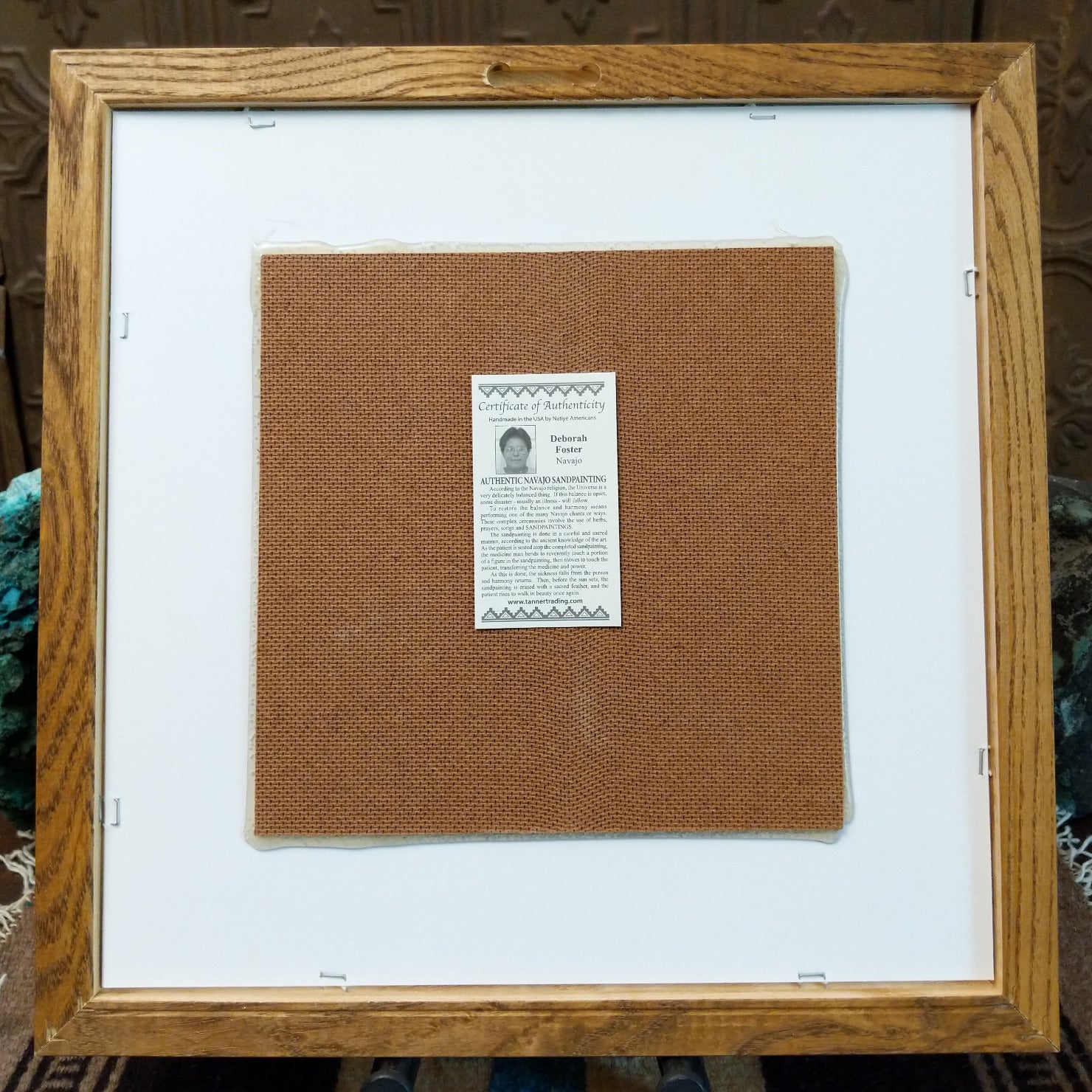 Backside of the Two Yei sand painting, showing the Certificate of Authenticity and Artist information.