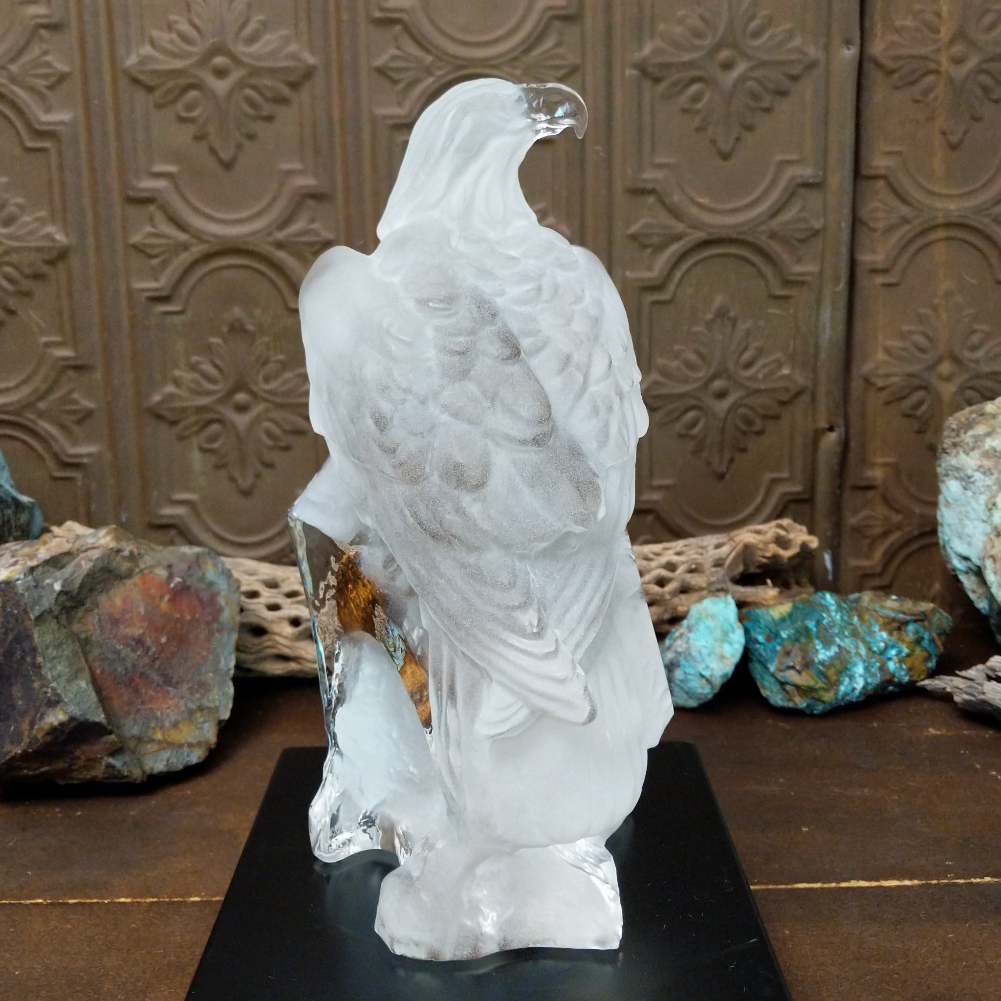 A frosted Lucite sculpture of a bald eagle with two hand-painted bald eagles soaring through the clear crystal interior.