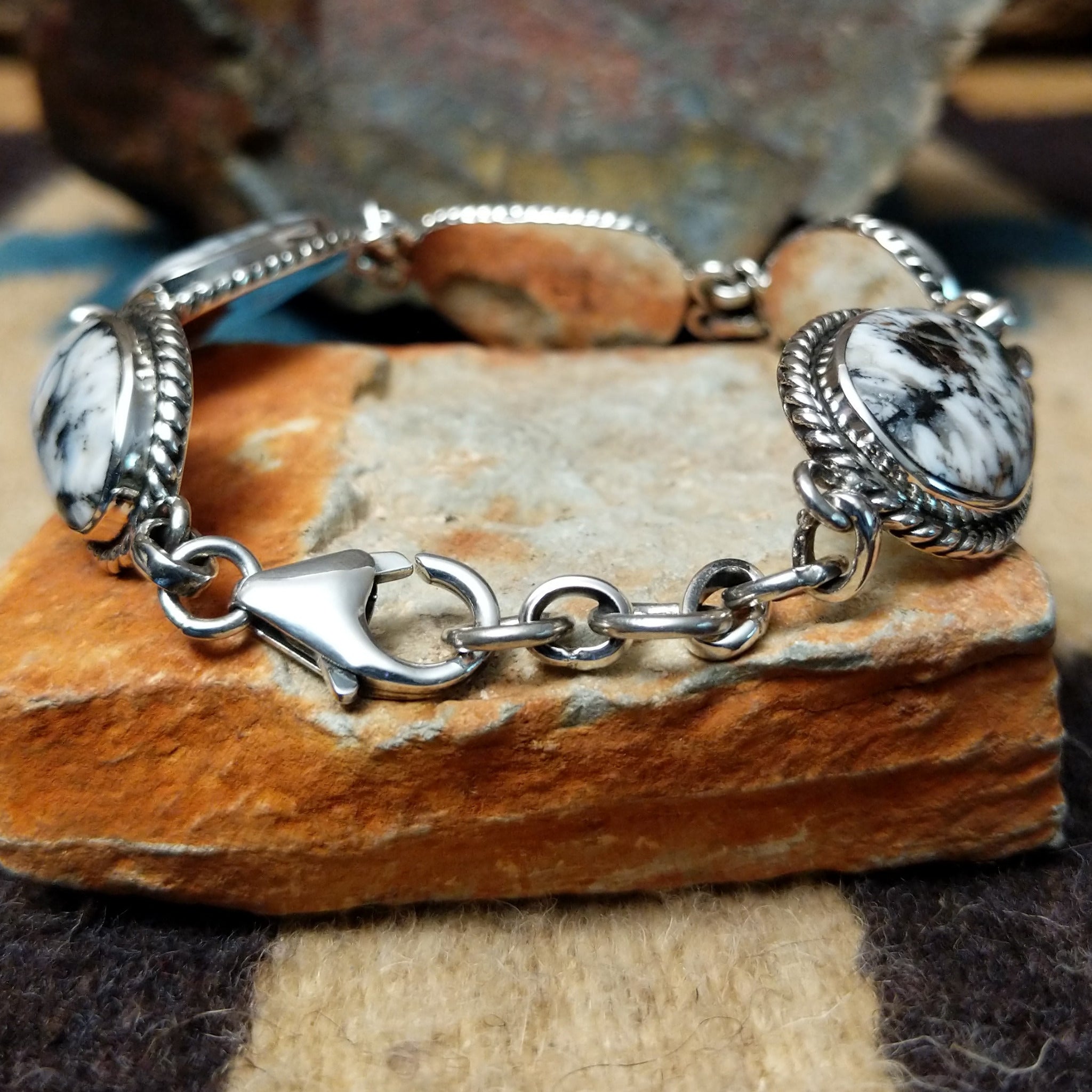 White Buffalo link bracelet by Terry Wood with natural black-and-white stones set in sterling silver; clasp view.