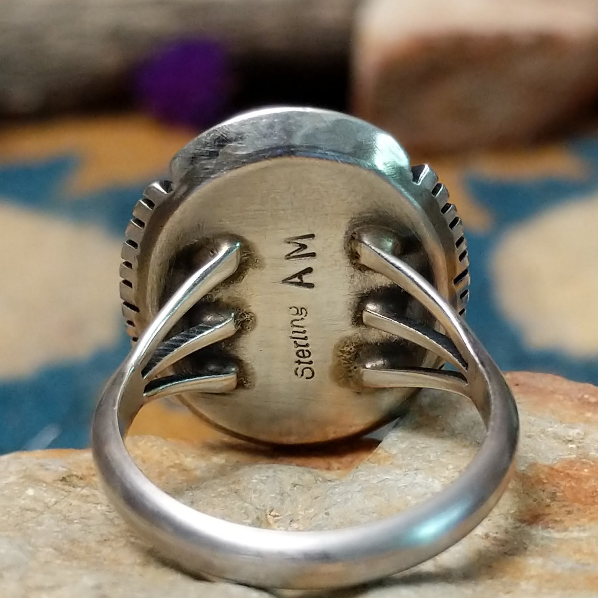 White Buffalo sterling silver ring by Alfred Martinez with an oval white stone and natural black veining; artisan and Sterling Silver stamp.