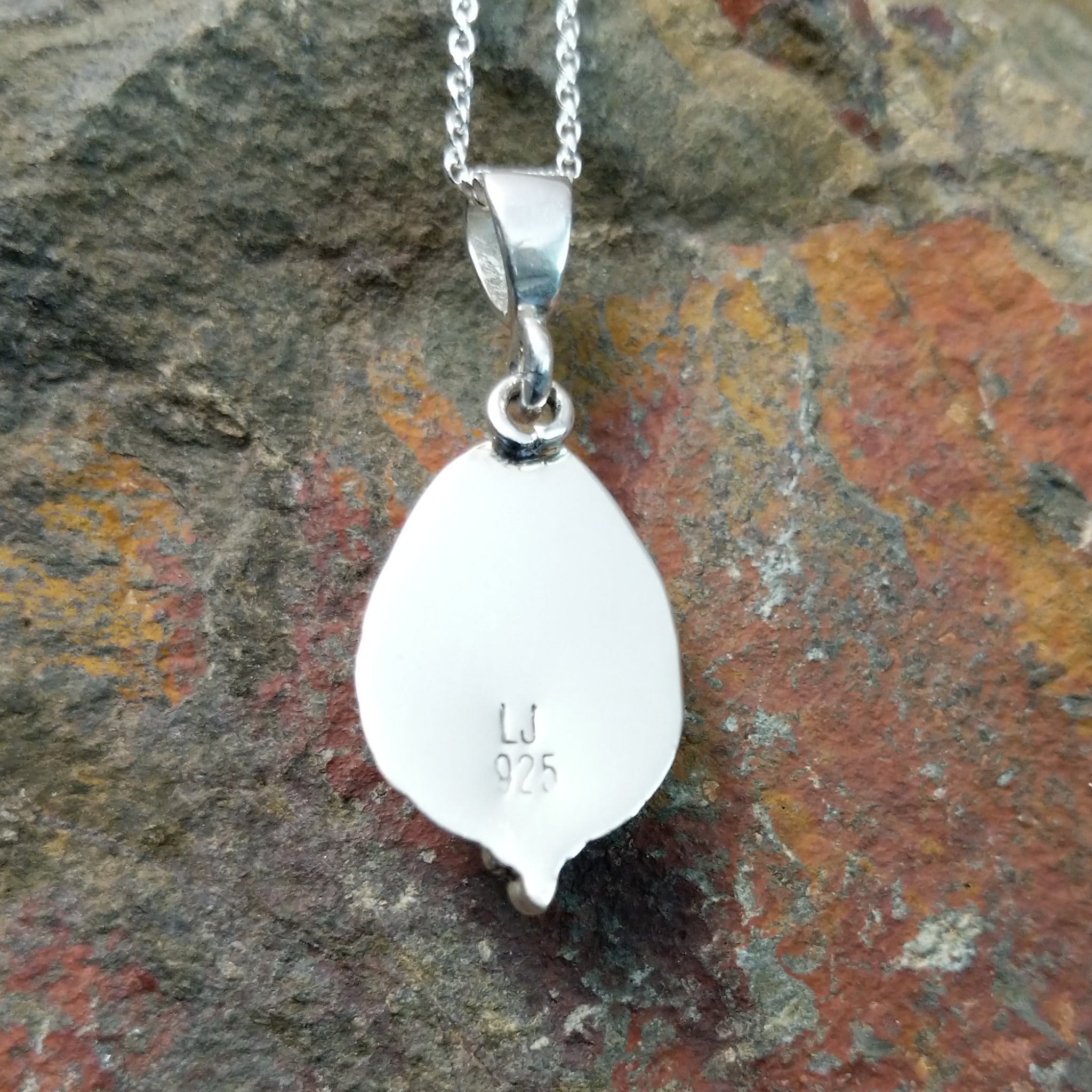 Handcrafted sterling silver White Water turquoise pendant by Lucy Jake, featuring a natural blue-green stone in a traditional Navajo setting; artisan and Sterling Silver stamp.