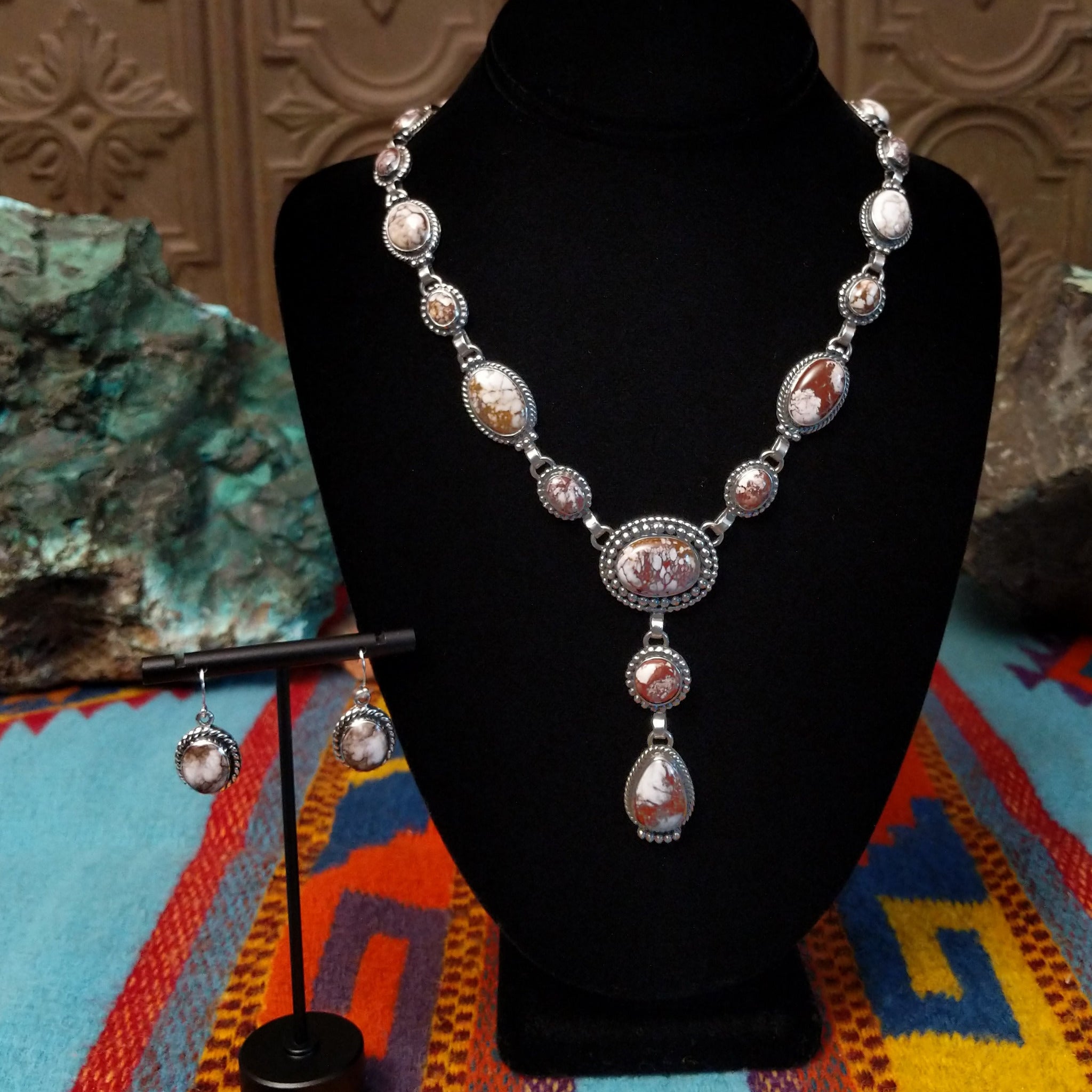 Wild Horse Sterling Silver necklace by Mary Ellen, featuring natural white, cream, brown, and reddish matrix stones in an intricate handcrafted design.