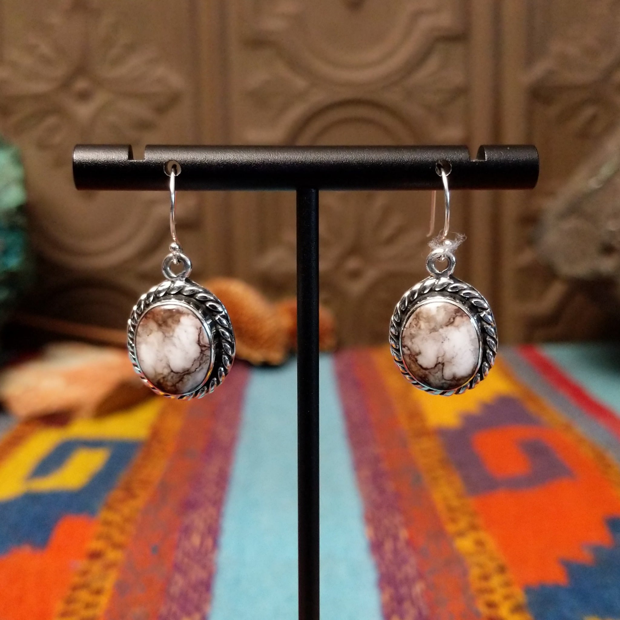 Wild Horse Sterling Silver earrings by Mary Ellen, featuring natural white, cream, brown, and reddish matrix stones in an intricate handcrafted design.