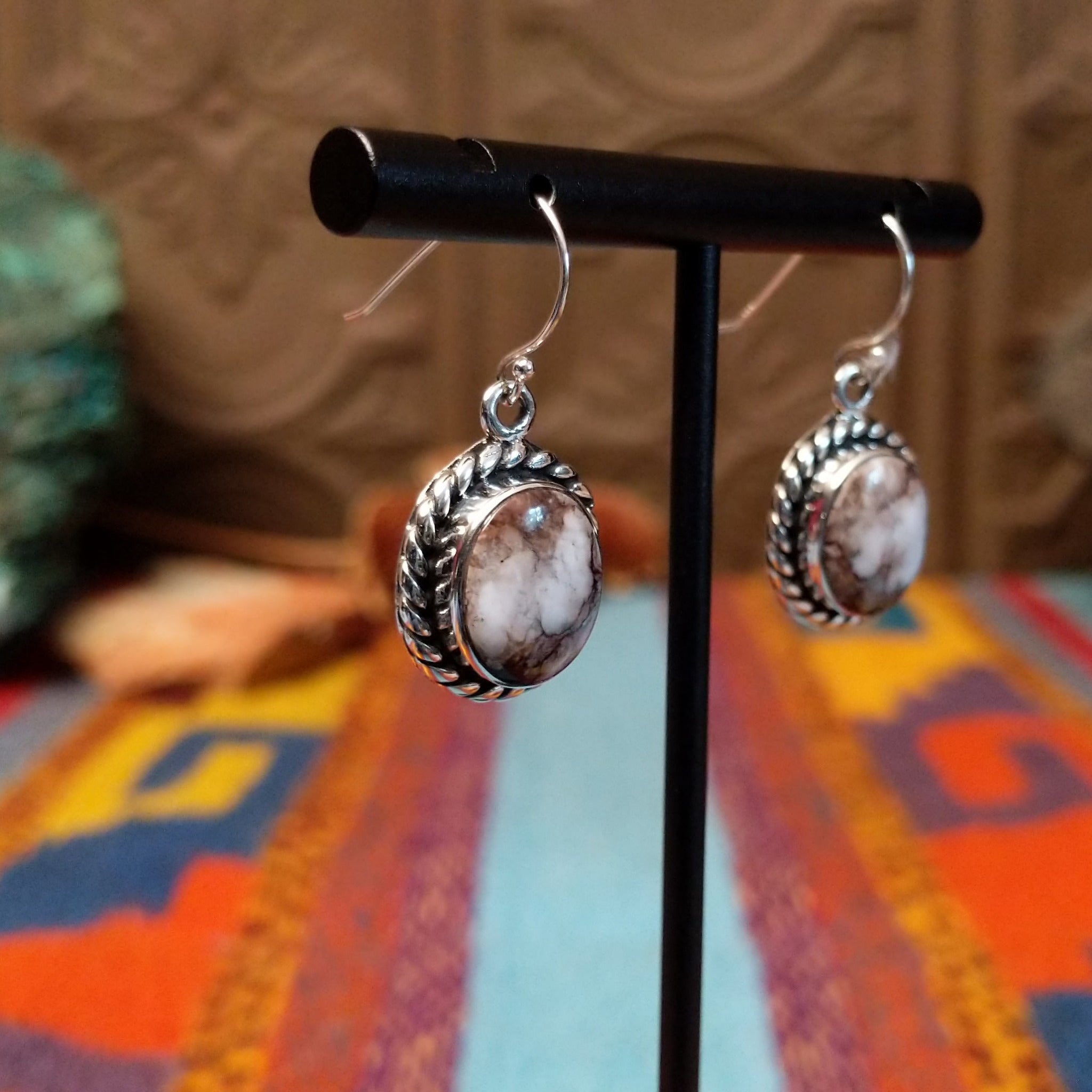 Wild Horse Sterling Silver earrings by Mary Ellen, featuring natural white, cream, brown, and reddish matrix stones in an intricate handcrafted design.