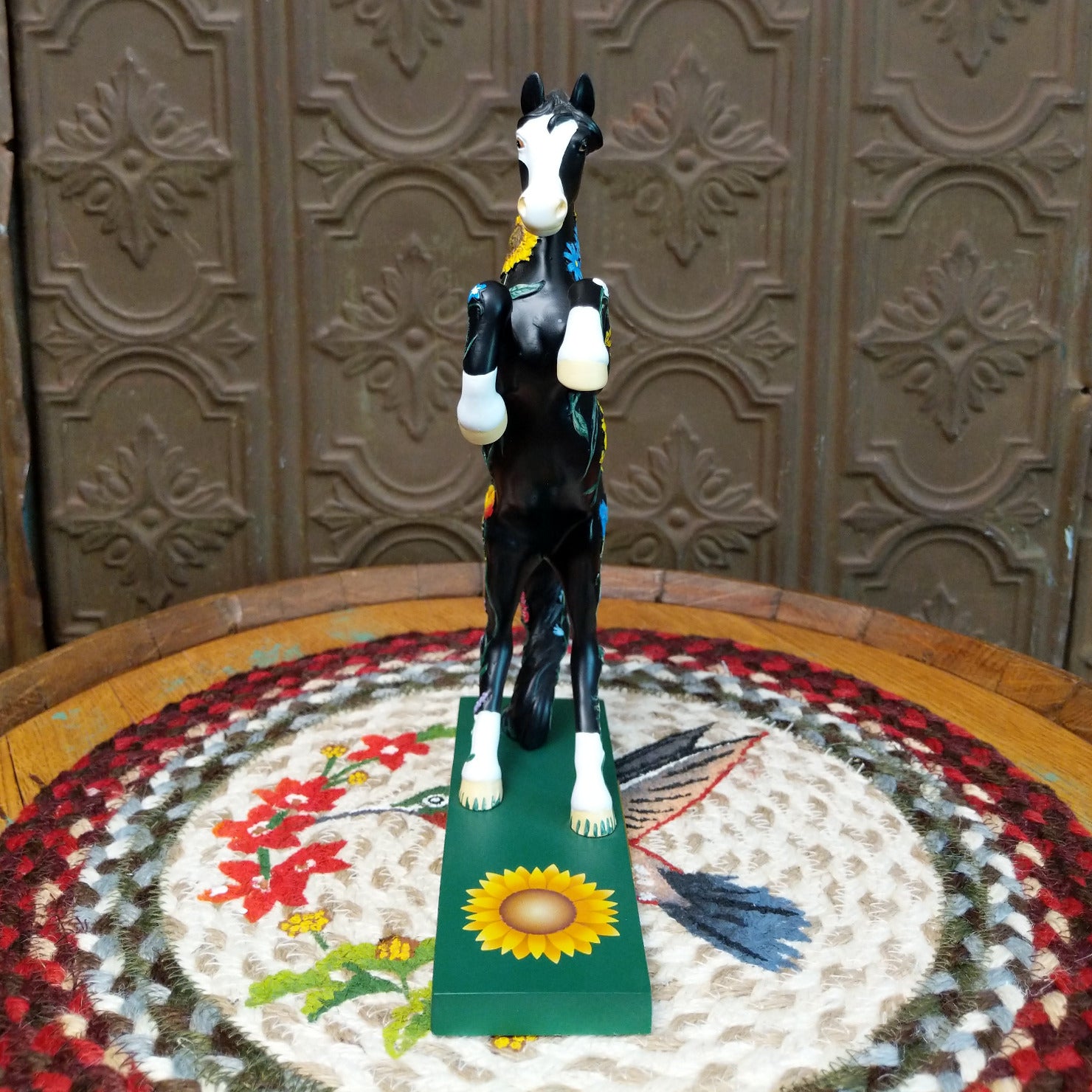 "Wildflower" collectible pony by The Trail of Painted Ponies, featuring detailed hand-painted floral artwork, vibrant colors, and nature-inspired design elements. Front view.