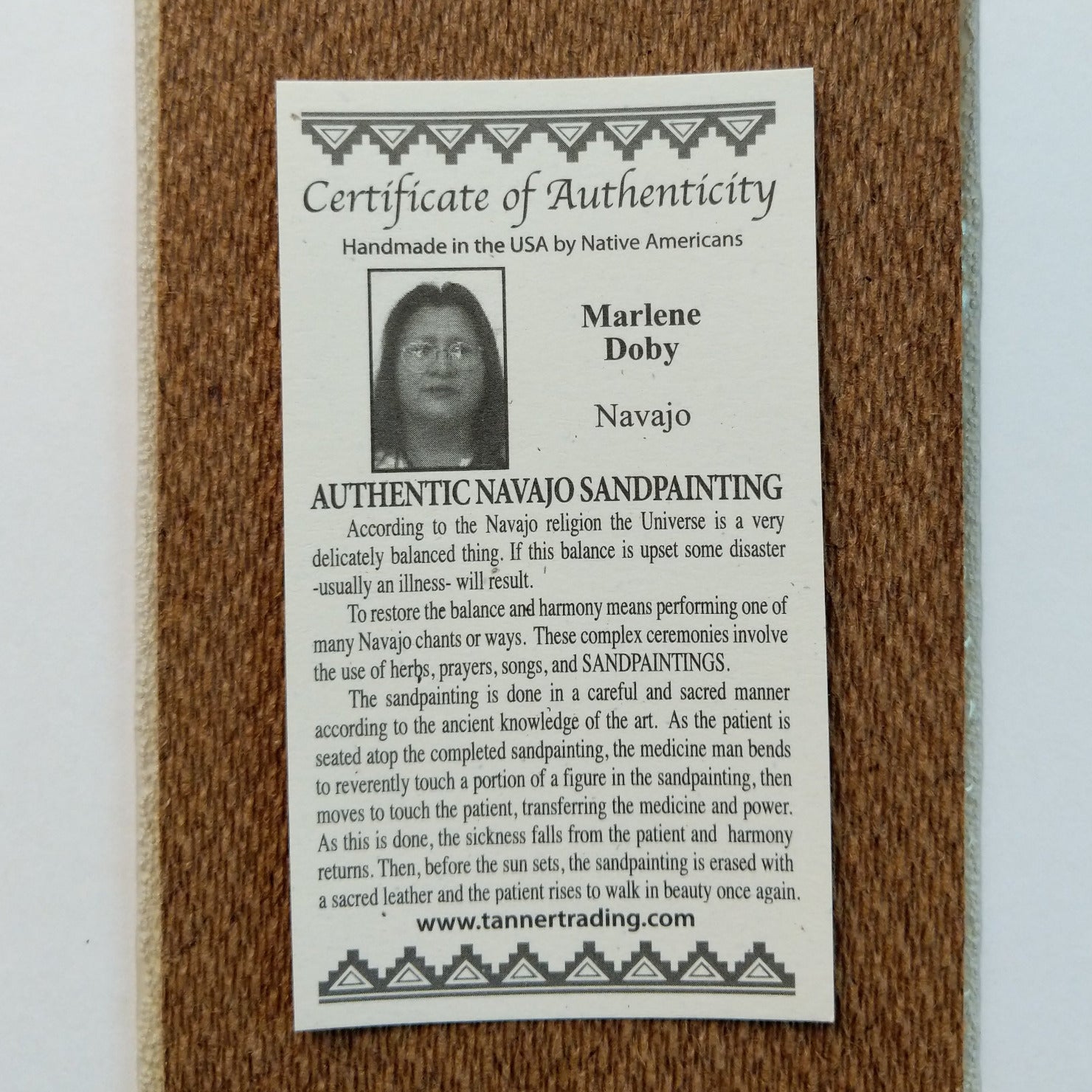 Close up of the Certificate of Authenticity and Artist information.