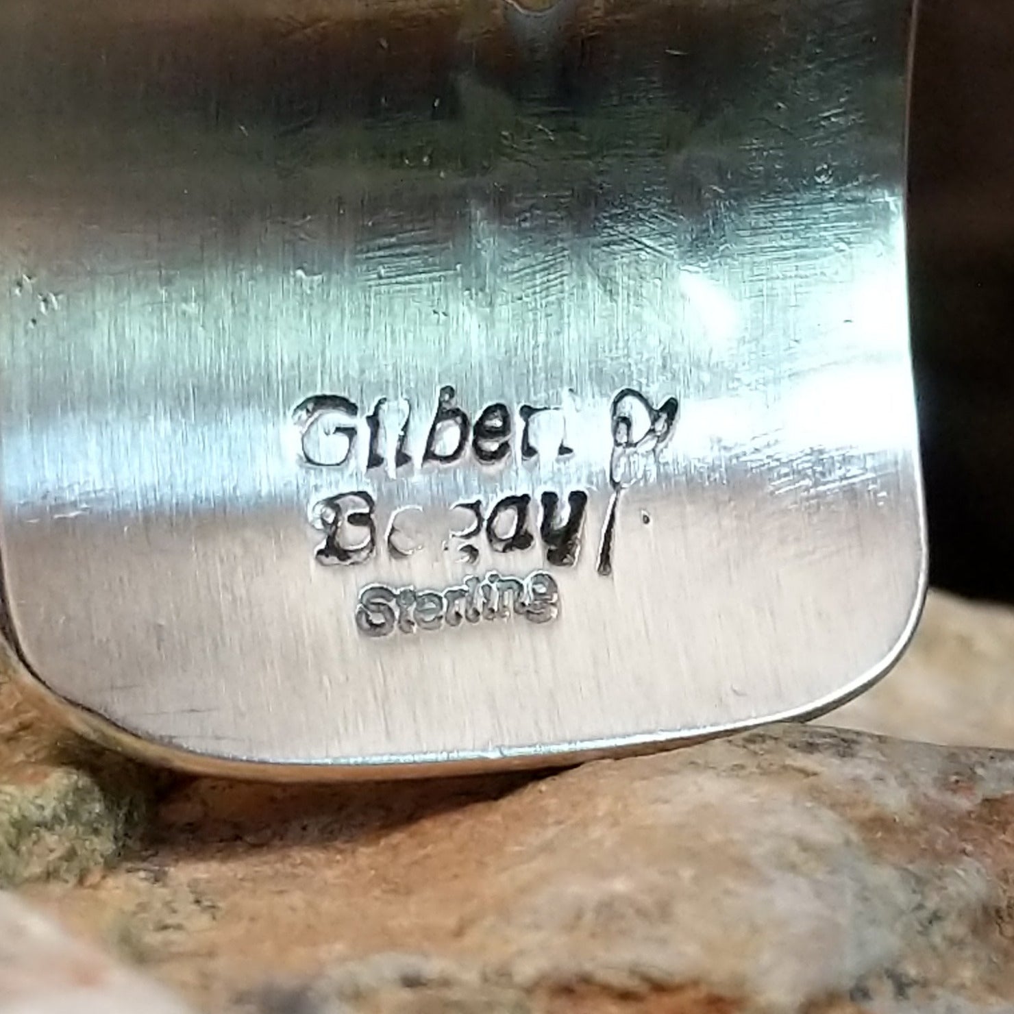 Close up of the artist's stamped signature.