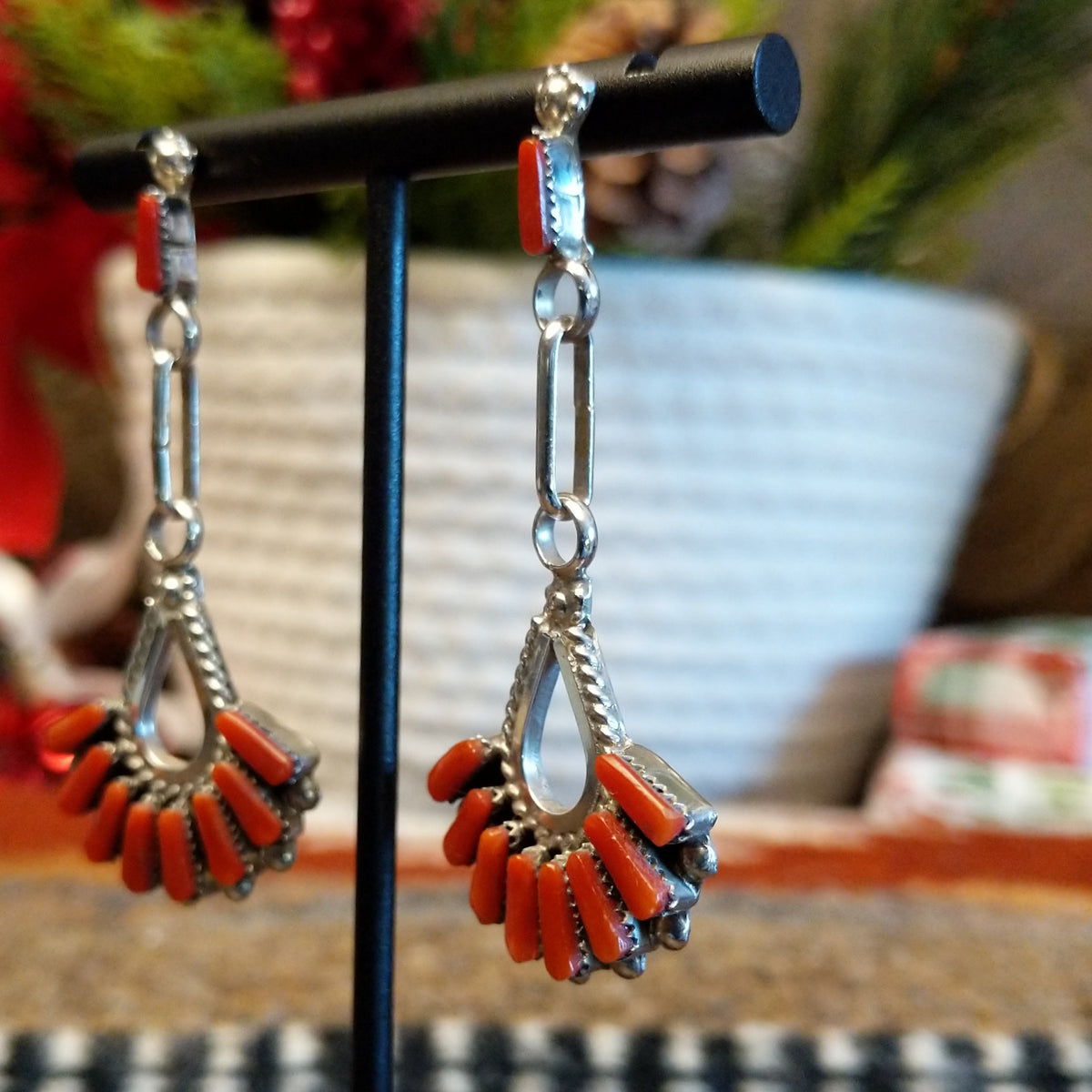 Coral set in bezels that form a chandelier and are set on dangle posts.