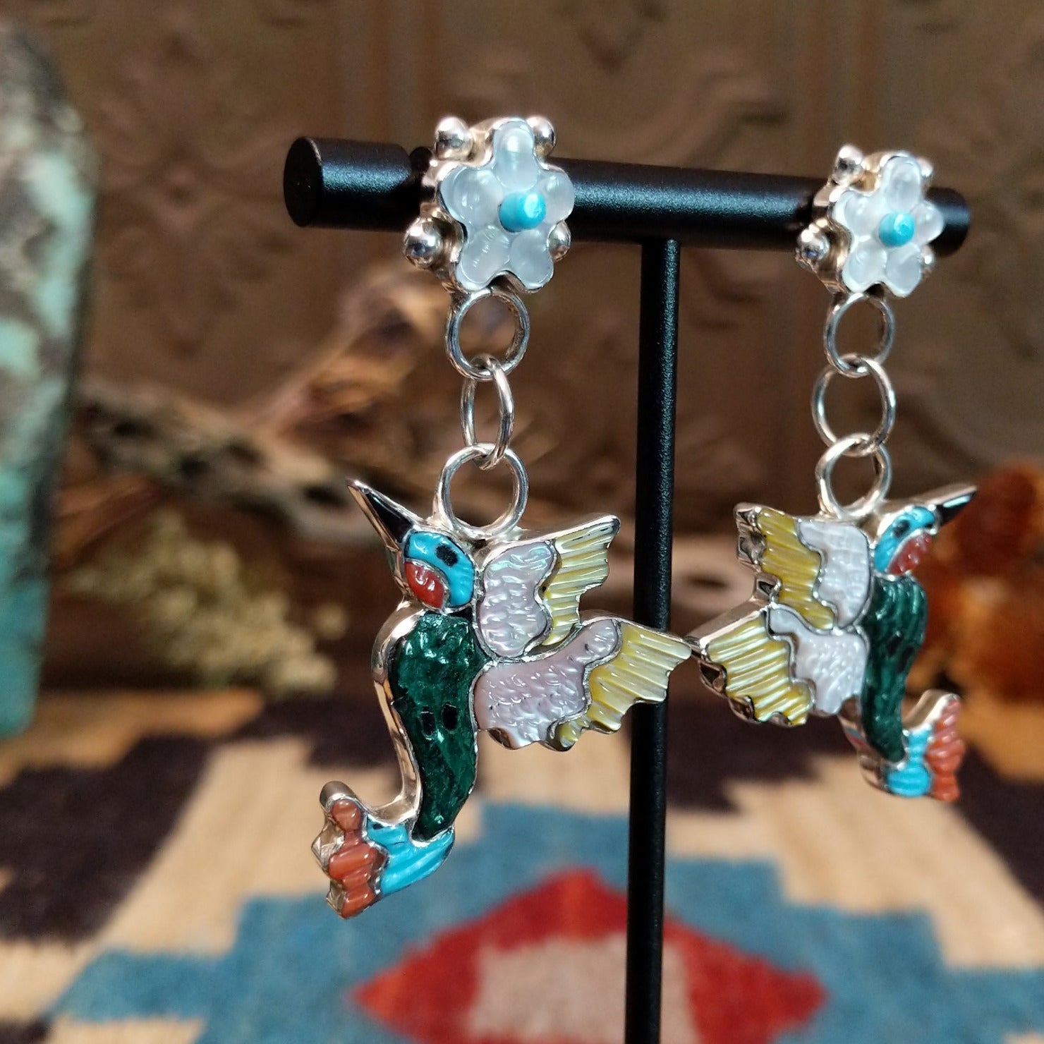 Sterling silver hummingbird earrings with multistone inlay.