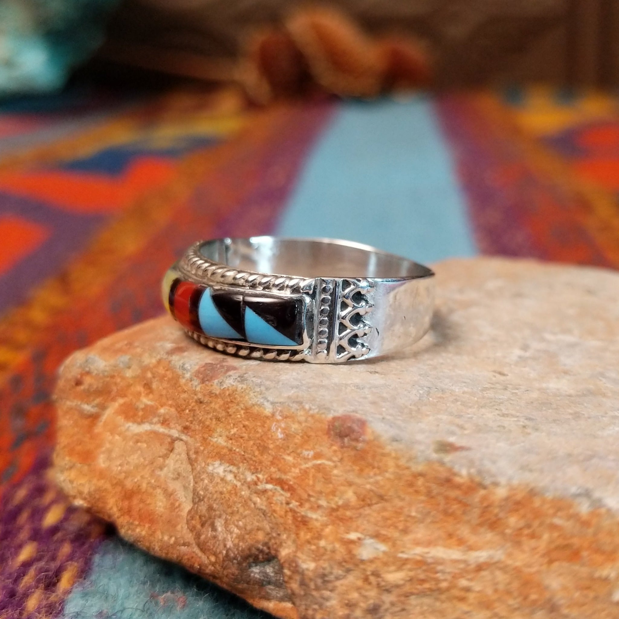 Zuni Inlay Ring by R. Sheyka with multistone geometric inlay and twisted silver borders.