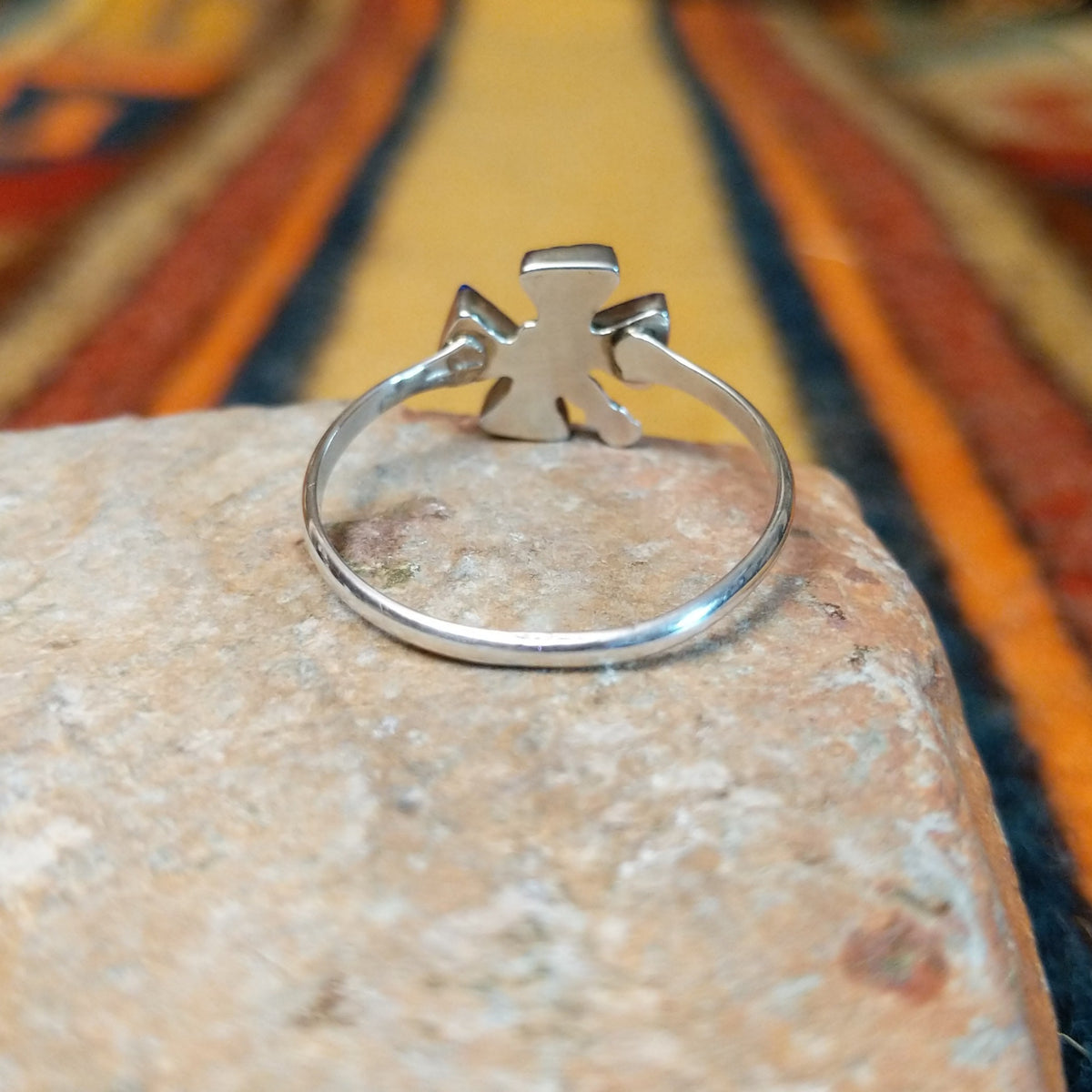 Zuni Lapis Dragonfly Ring featuring four triangular deep blue lapis lazuli inlay stones forming dragonfly wings, accented with sterling silver beads and a slender silver band; underside view.
