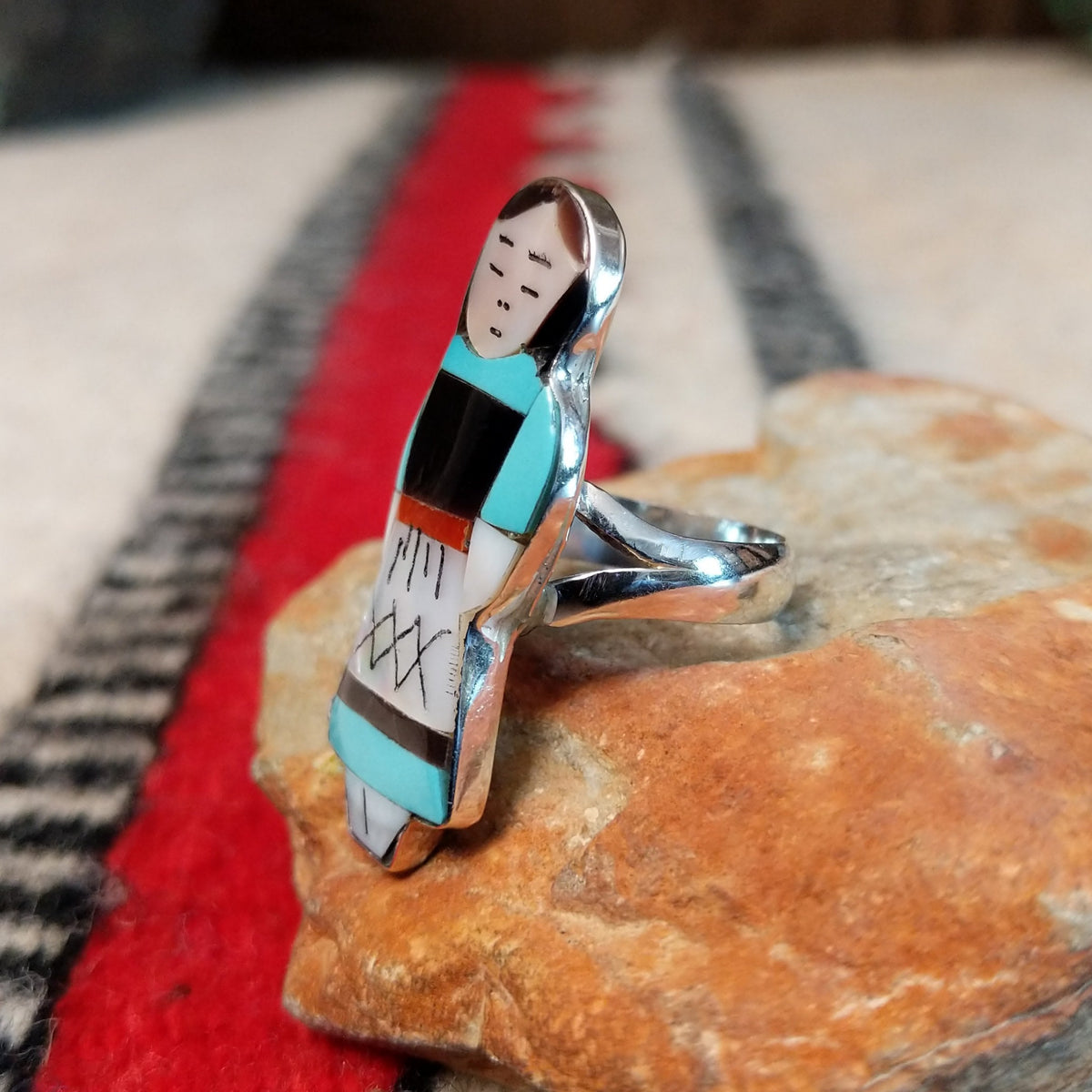 Zuni inlay maiden ring by Theresa Waseta with shell, turquoise, coral, and dark stone.