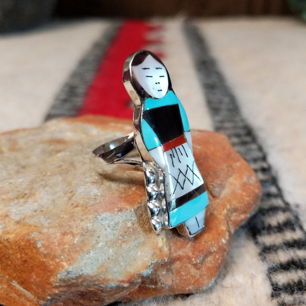 Zuni inlay maiden ring by Theresa Waseta with shell, turquoise, coral, and dark stone.
