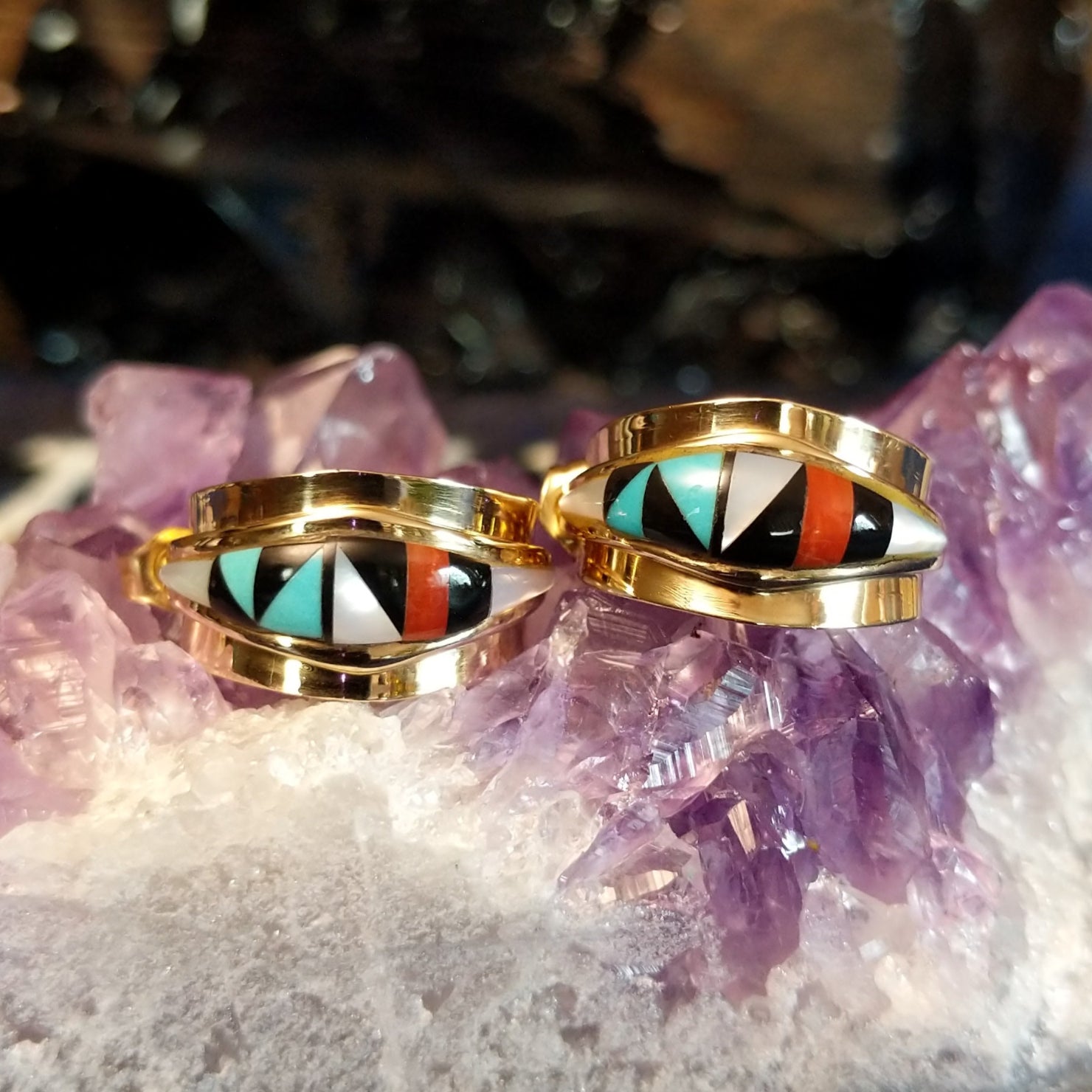 Zuni hoop earrings with multi-stone inlay in gold.