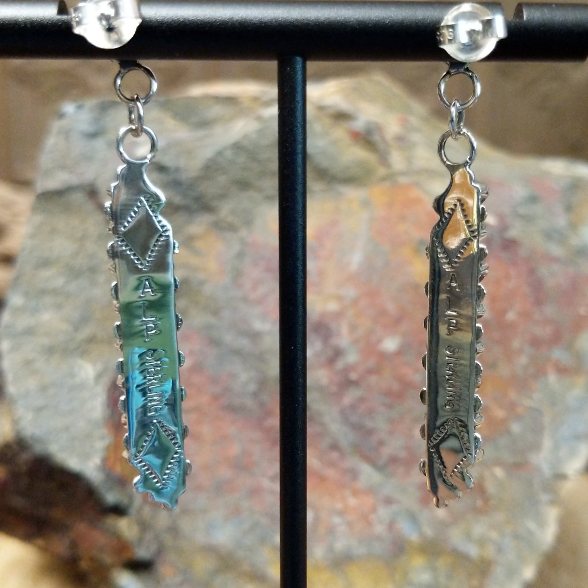 Handcrafted sterling silver Zuni turquoise and coral needlepoint earrings by Lamar Peywa, featuring elongated dangle inlay with coral stud tops; artisan and Sterling Silver stamp.