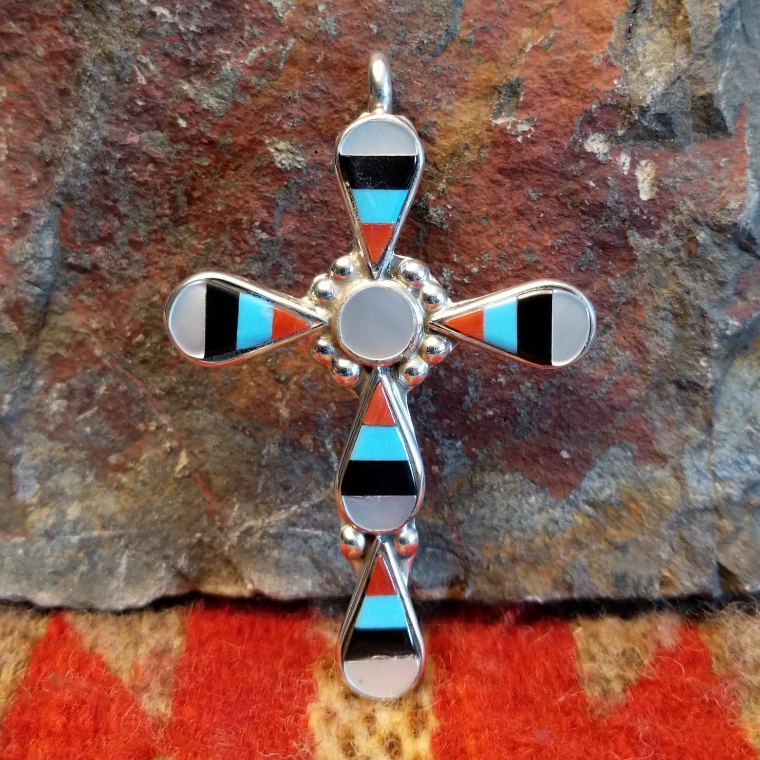 Zuni sterling silver teardrop inlay cross pendant by Zeno and Maryann Edaakie.