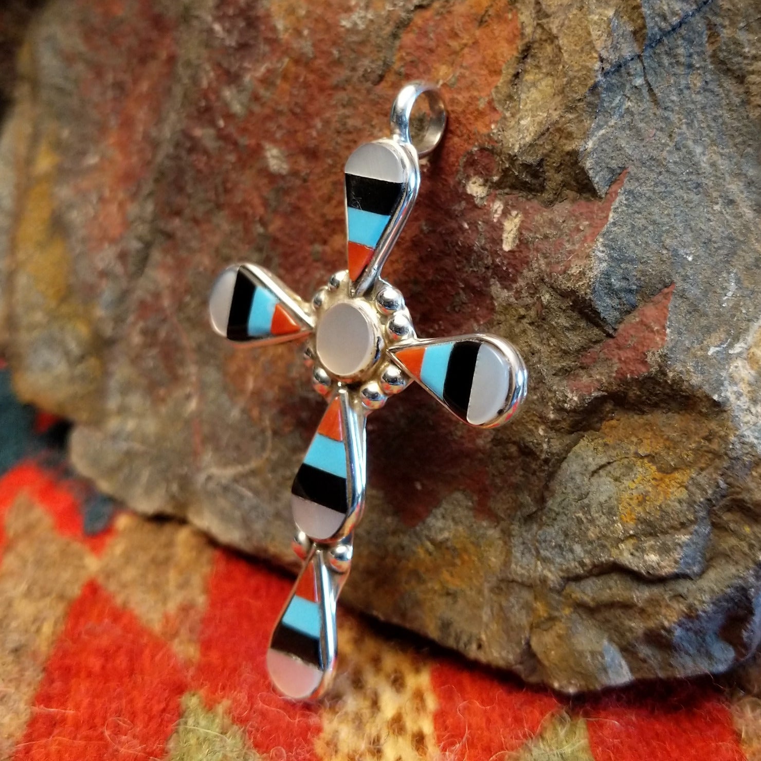 Zuni sterling silver teardrop inlay cross pendant by Zeno and Maryann Edaakie.