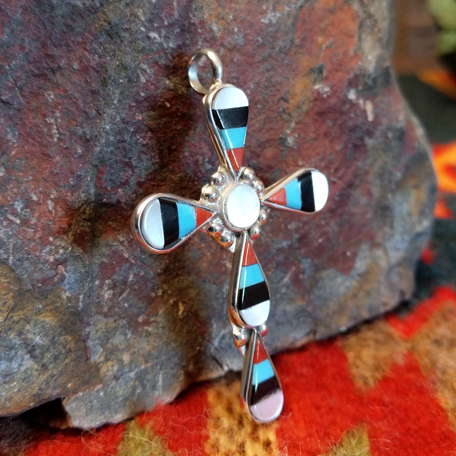 Zuni sterling silver teardrop inlay cross pendant by Zeno and Maryann Edaakie.