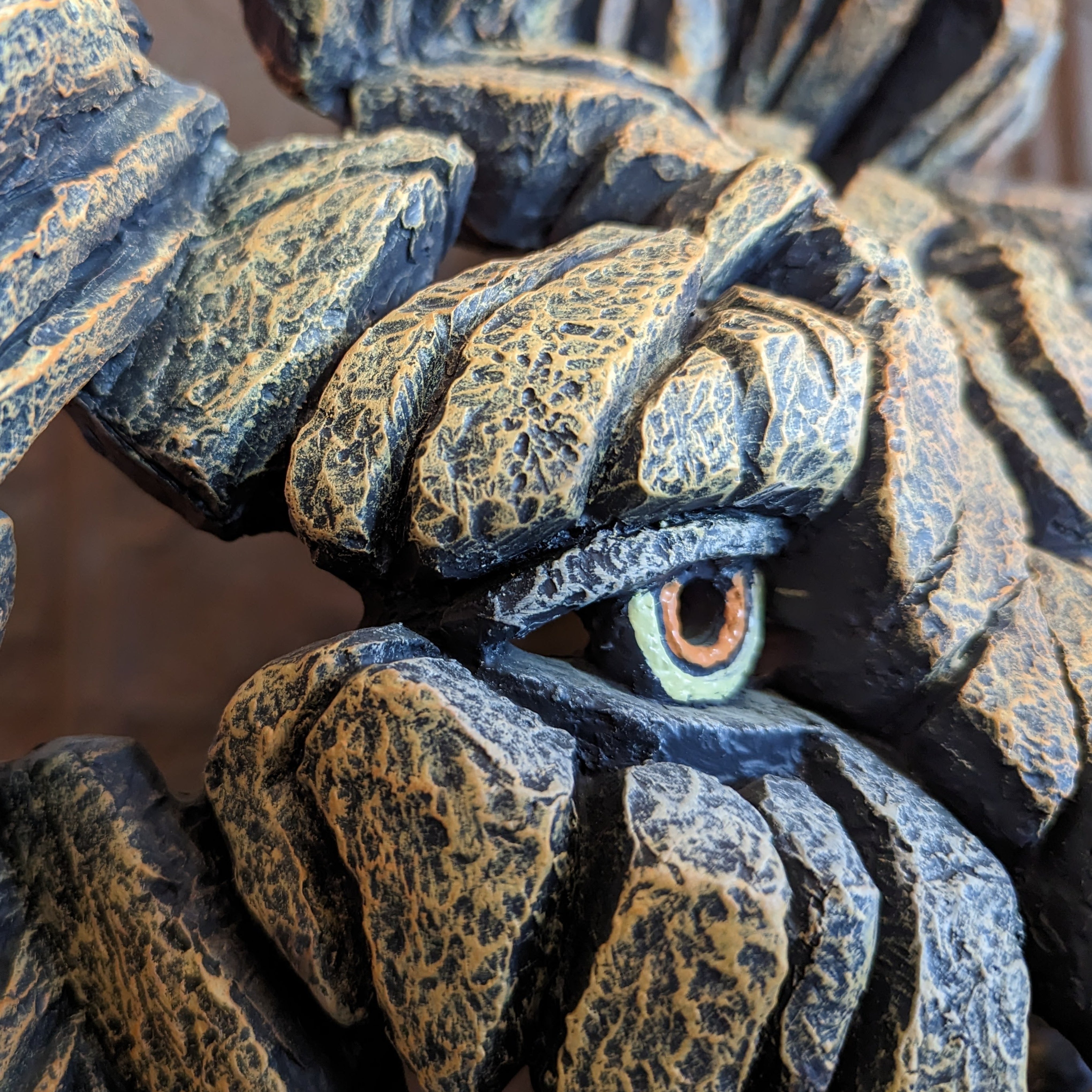 edge sculpture lion head right side closeup