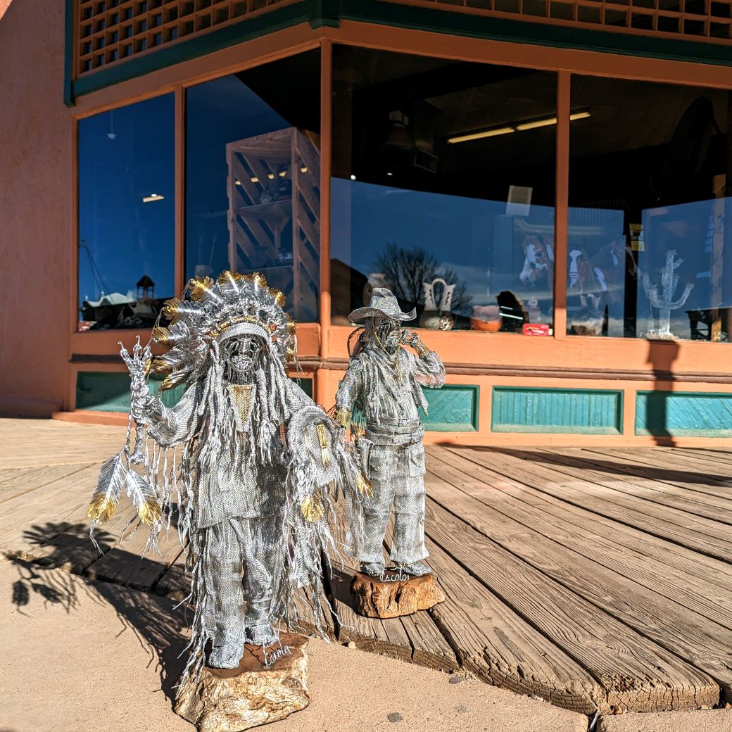 a collection of native american made sculptures and figurines