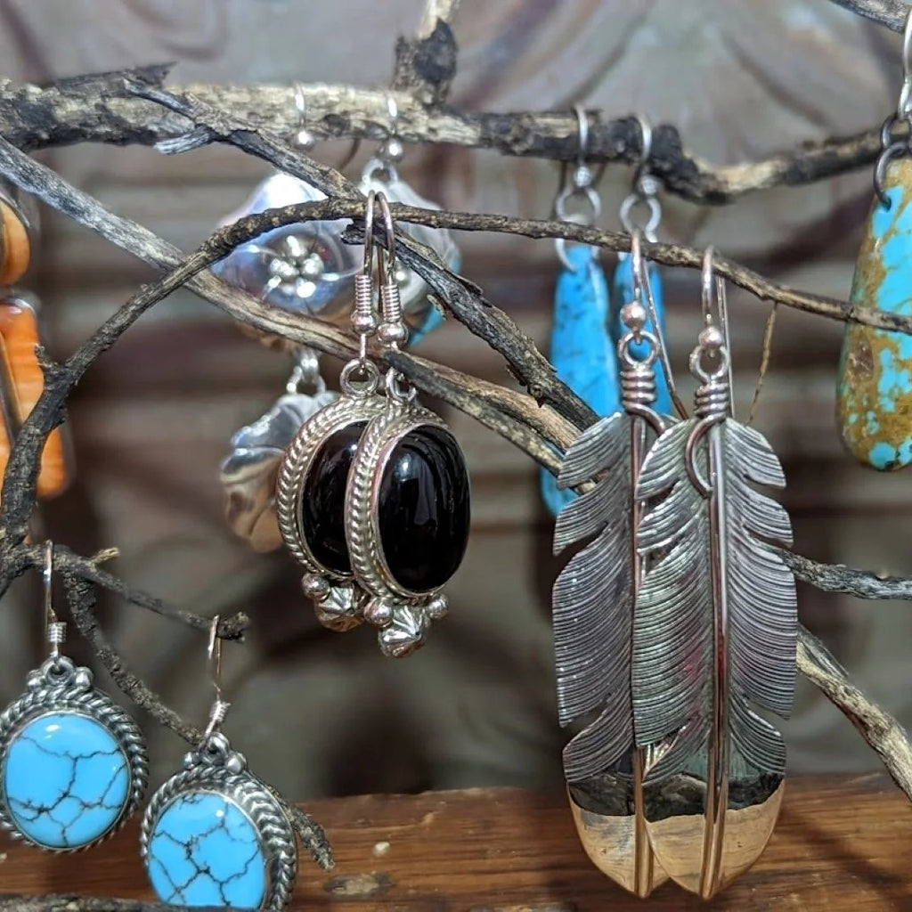 a collection of native american made earrings