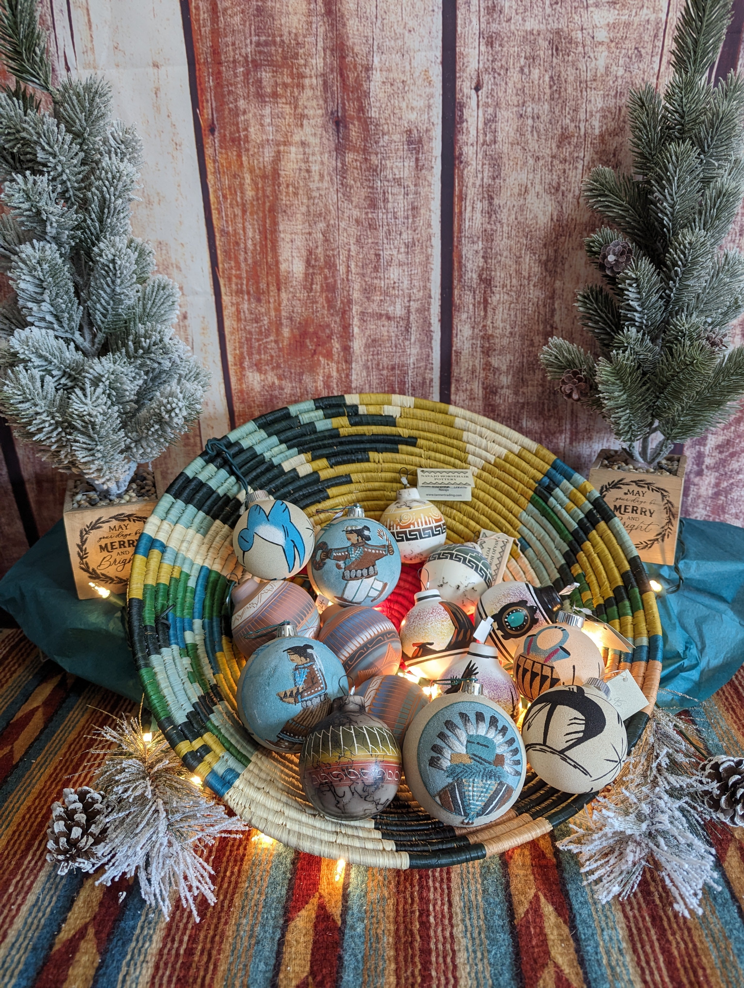 An assortment of various ornaments with multiple colors and beautiful designs in a decorative basket.