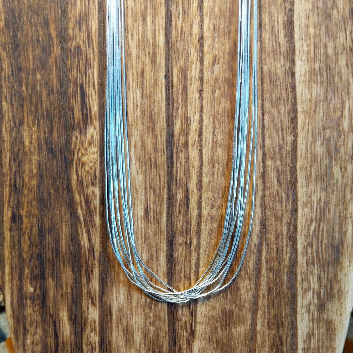 Ten strands of sterling silver beaded together used to create the necklace.