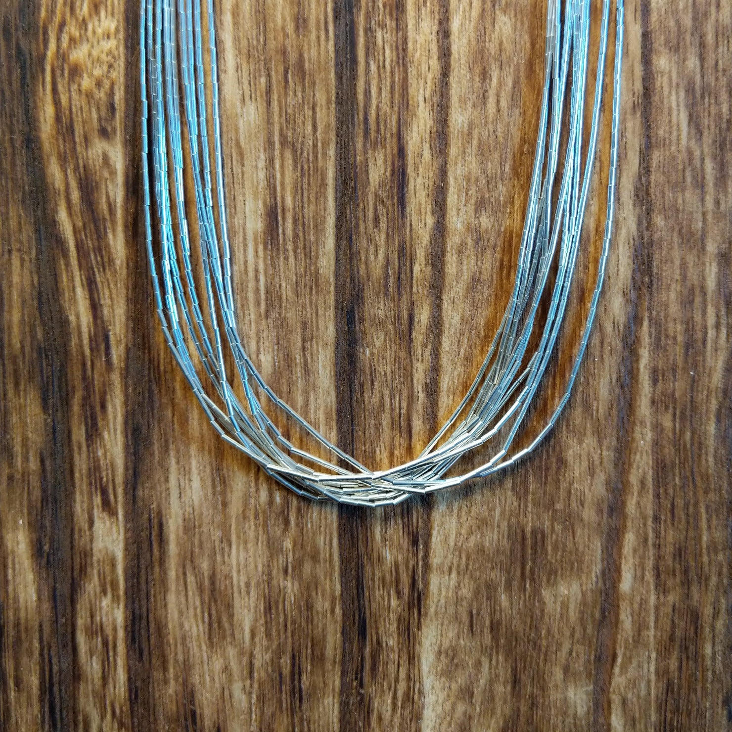 Ten strands of sterling silver beaded together used to create the necklace.