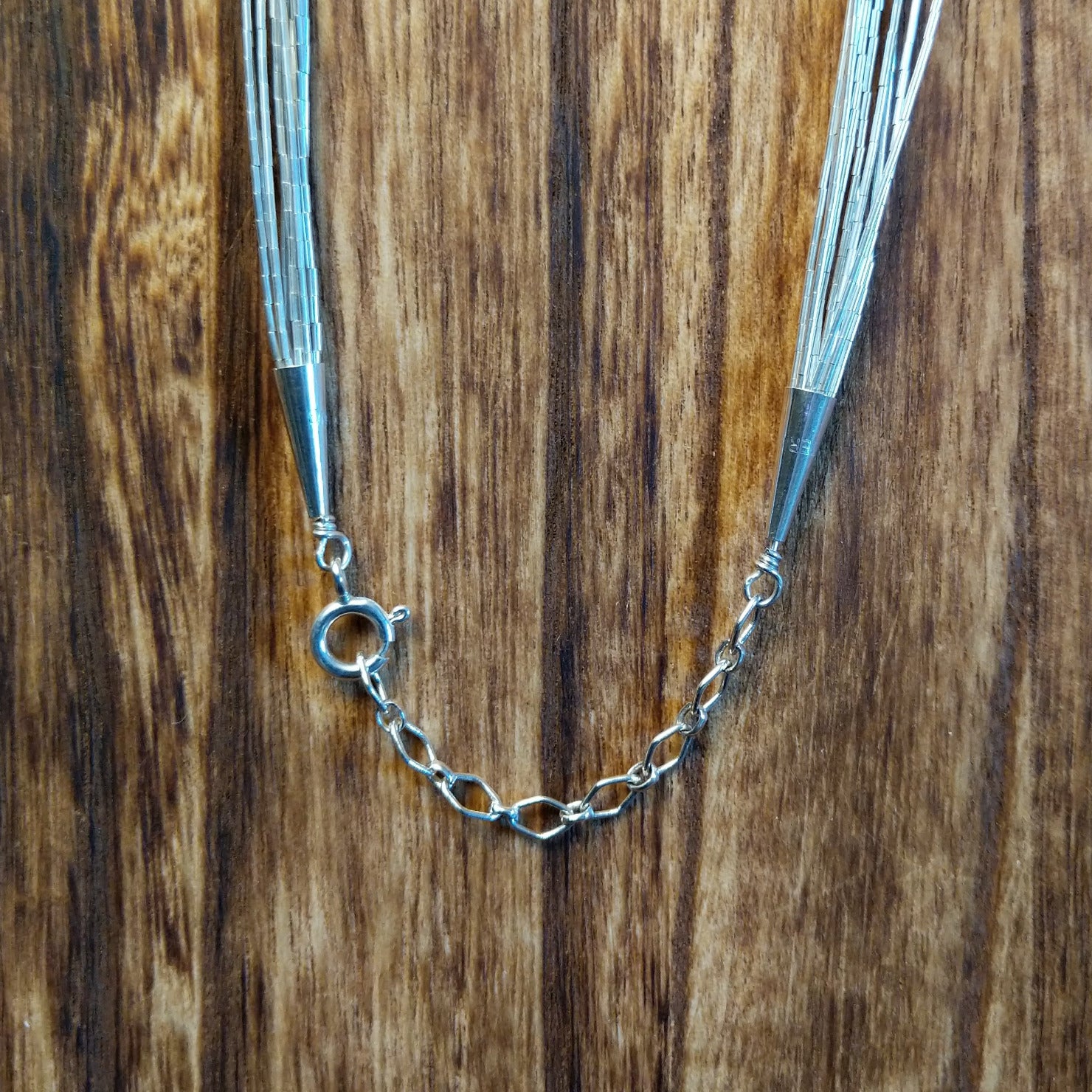 Close-up of necklace's clasp.