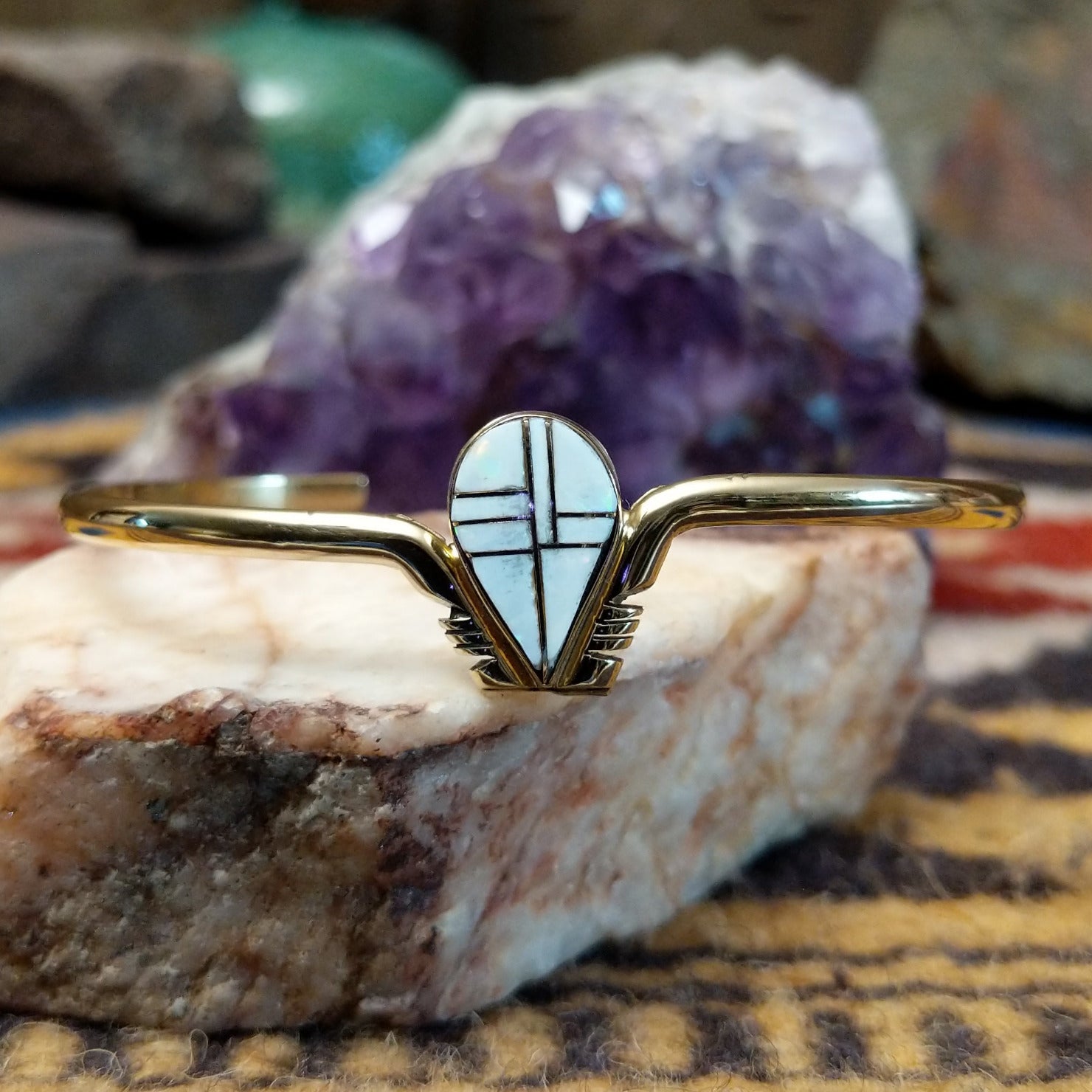 14k gold cuff by Hyson Craig with teardrop opal inlay and geometric gold channels.