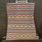 Wide Ruins Navajo Rug features alternating vertical stripes and elongated diamond motifs in soft earth tones 