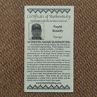 Close up of the Certificate of Authenticity and Artist information. 